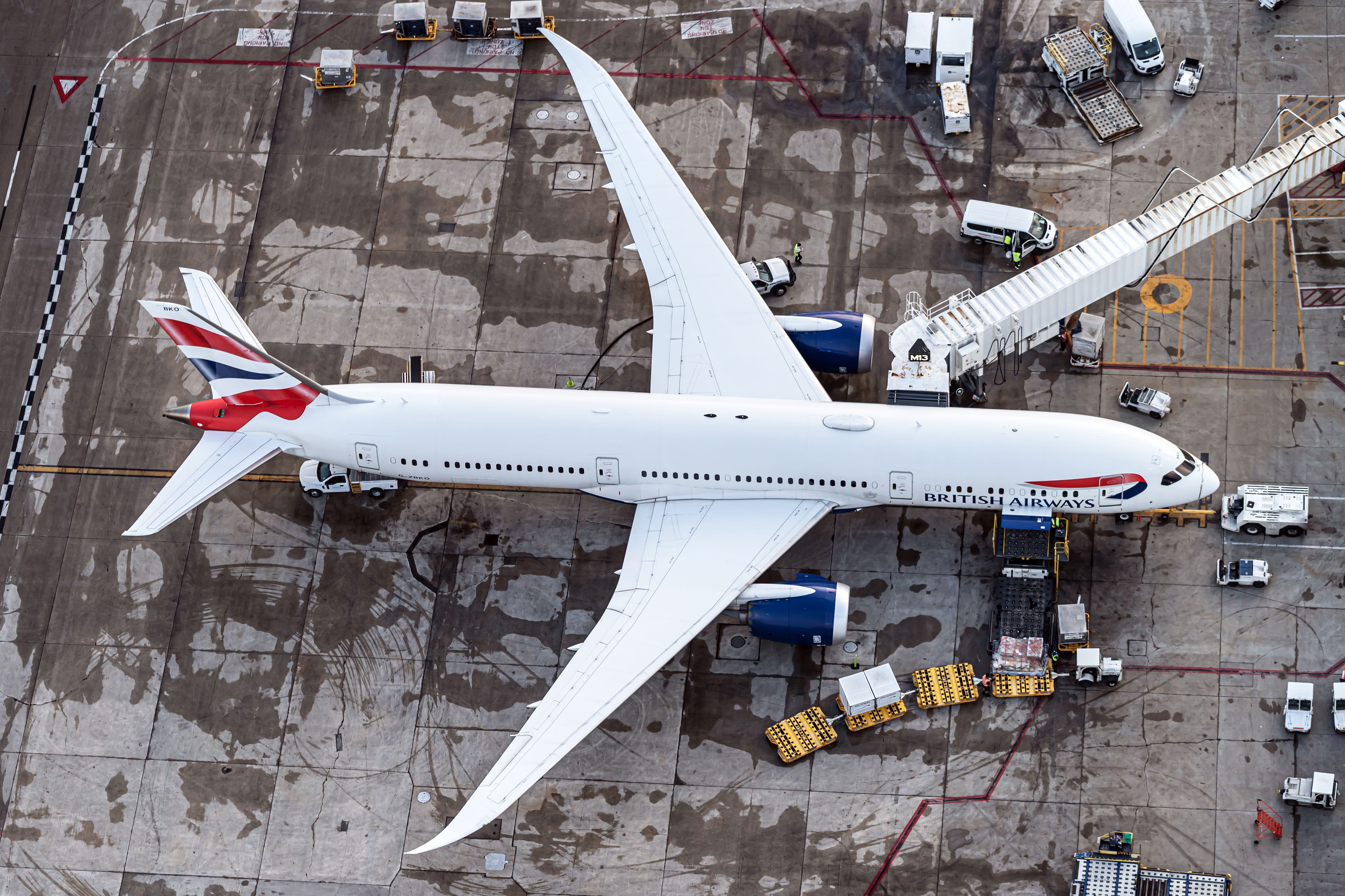 A British Airways Boeing 787-9 parked at an airport gate.