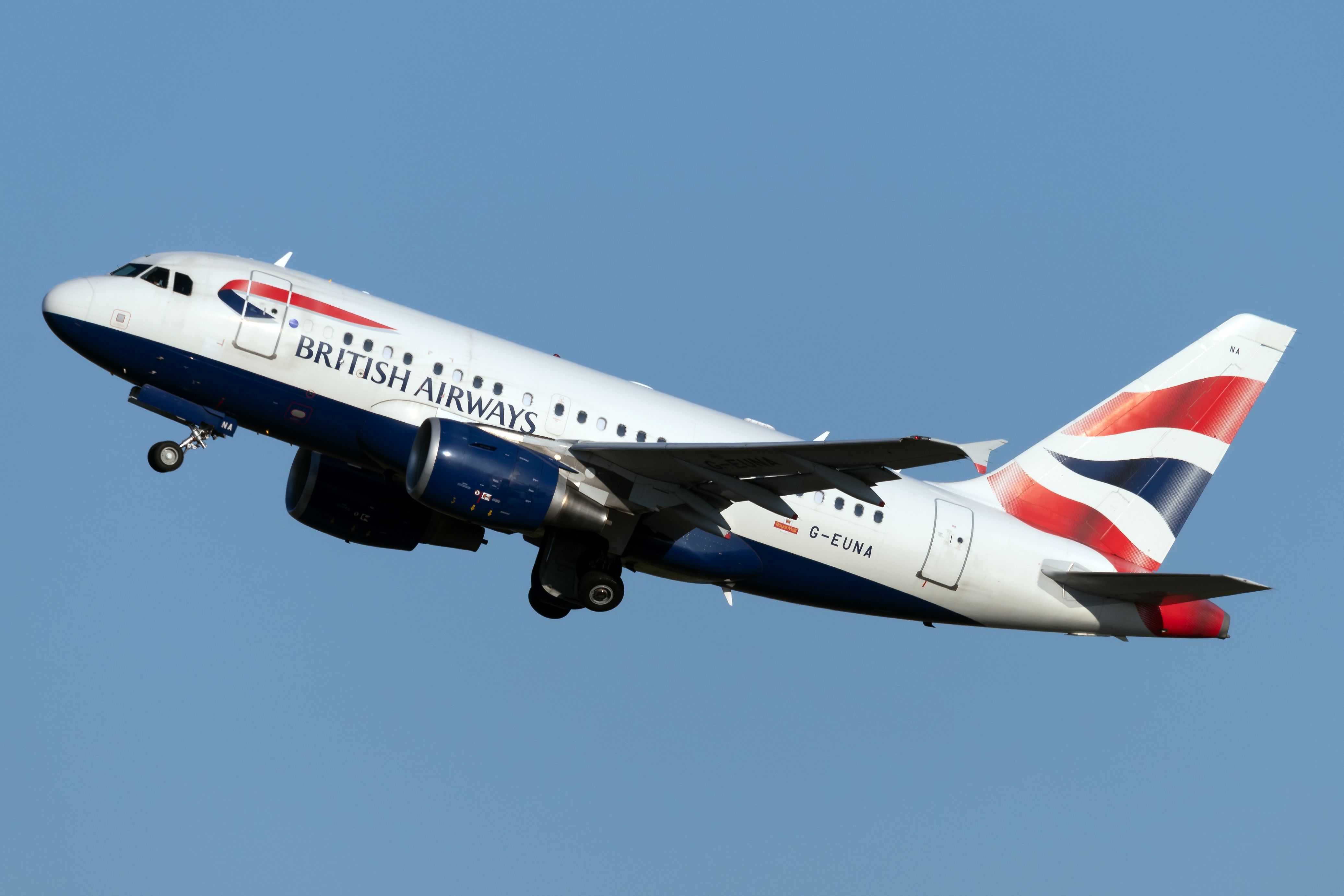 A British Airways Boeing A318 flying in the sky.