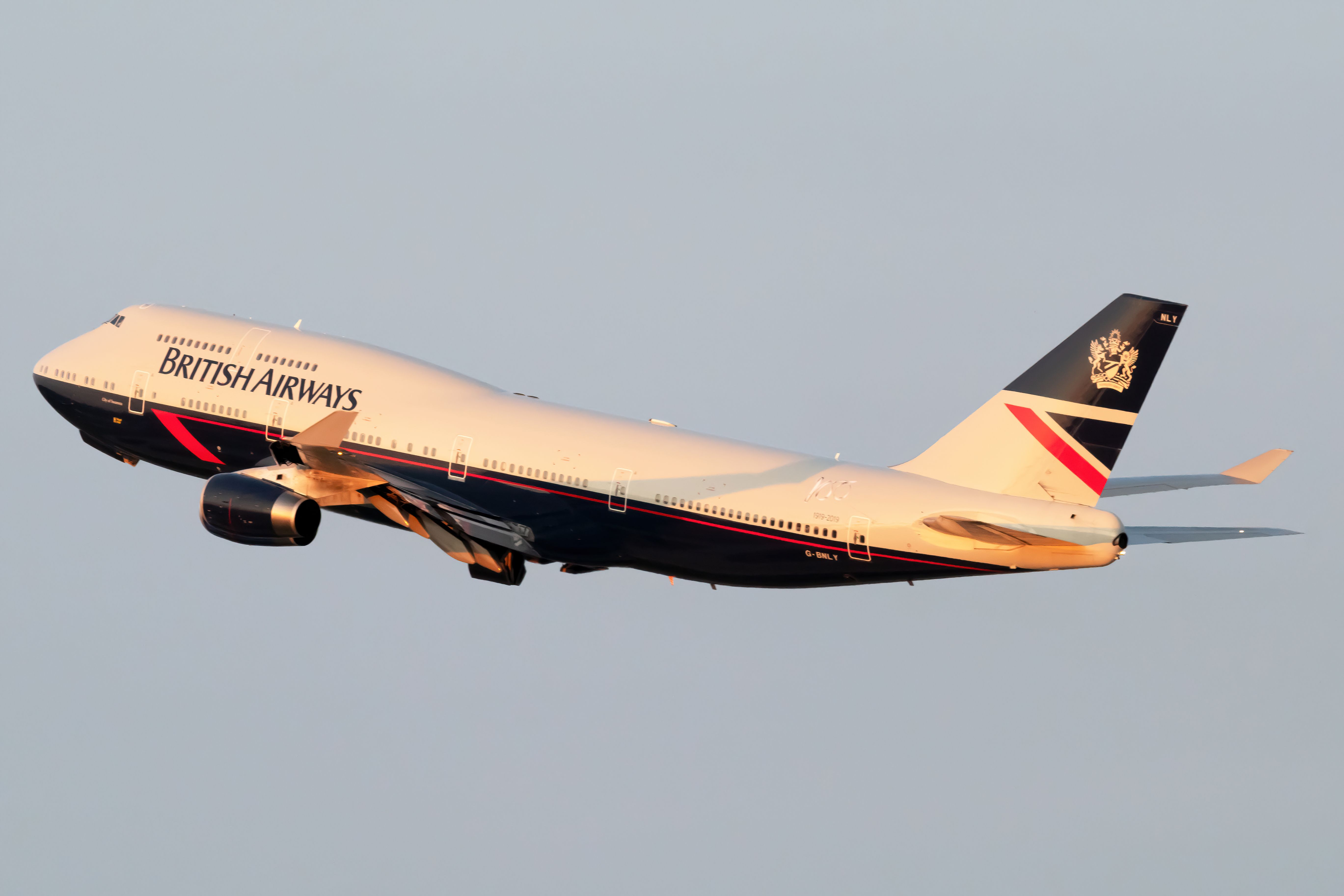 A British Airways (Landor Retro Livery) Boeing 747-436, registration G-BNLY, flying in the sky.