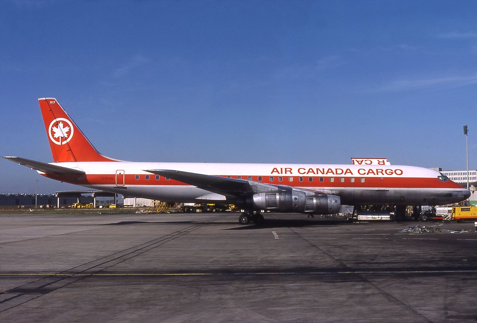 White jetliner with red paint on the side and marked Air Canada Cargo