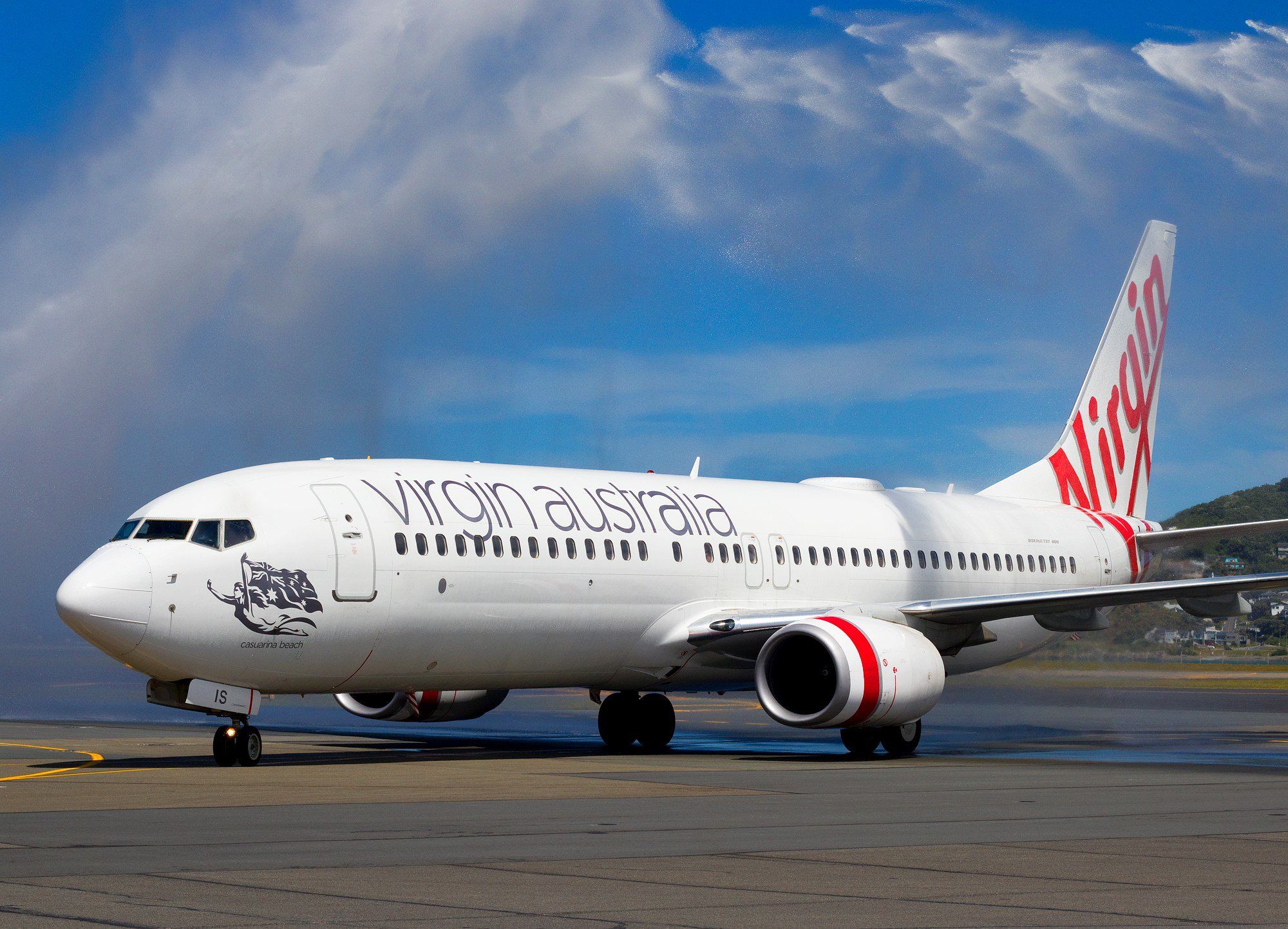 Virgin Australia Boeing 737-800 under a water cannon salute.