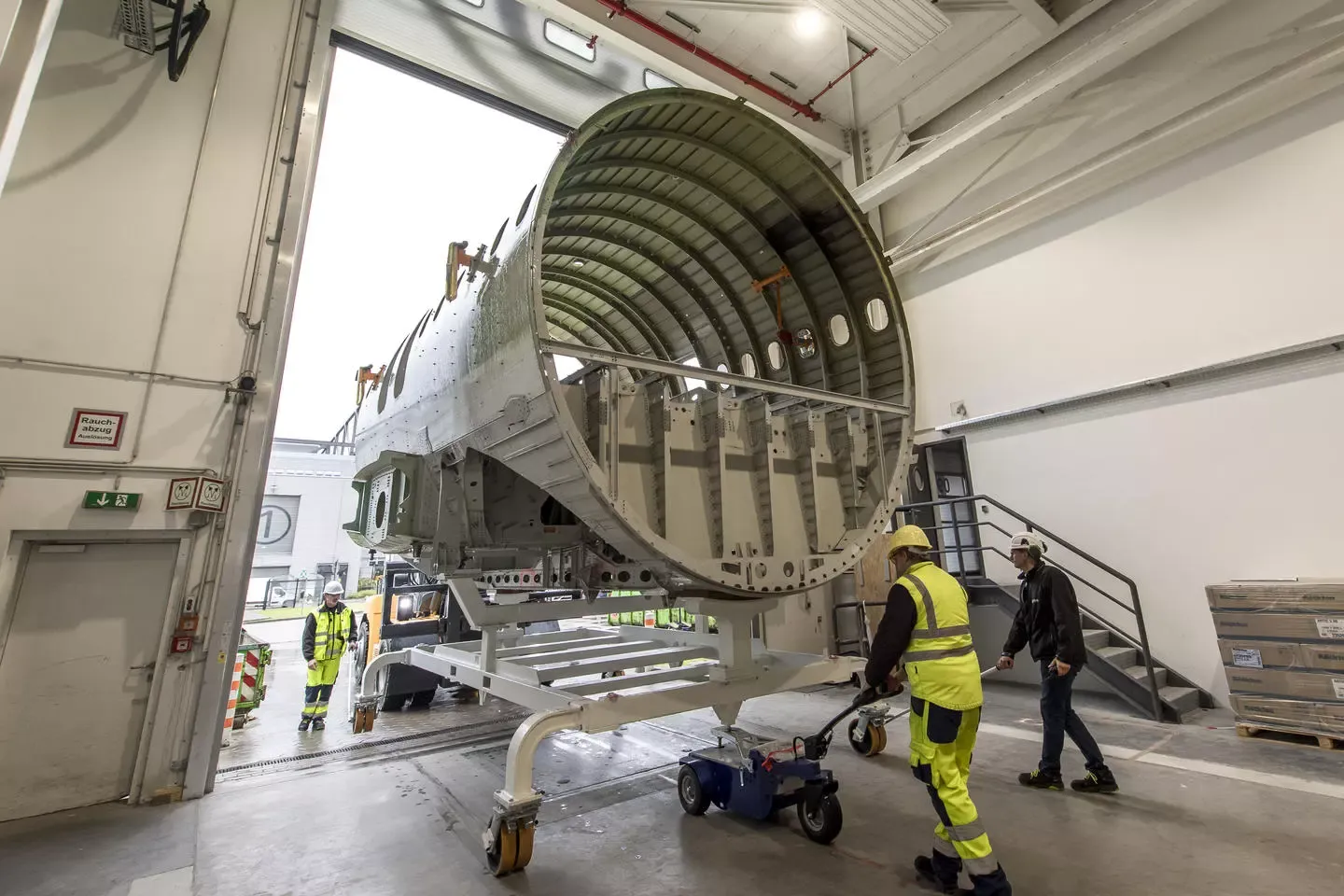 A Fuselage being moved to a new hangar at the Airbus factory.