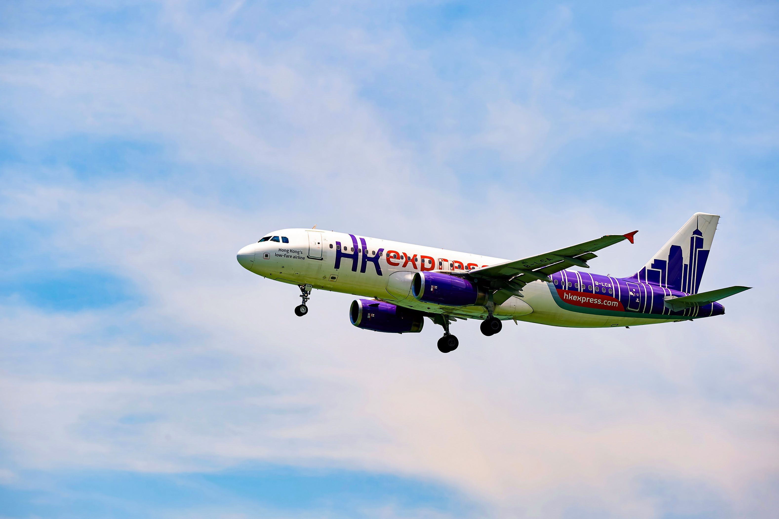 A Hong Kong Express Airbus A320ceo flying in the sky. 