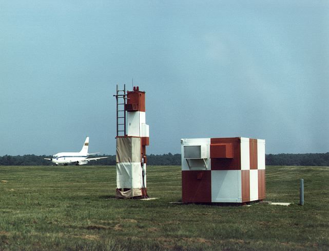 NASA's Boeing 737 research aircraft on the Wallops runway in 1987, with Microwave Landing System equipment in the foreground.