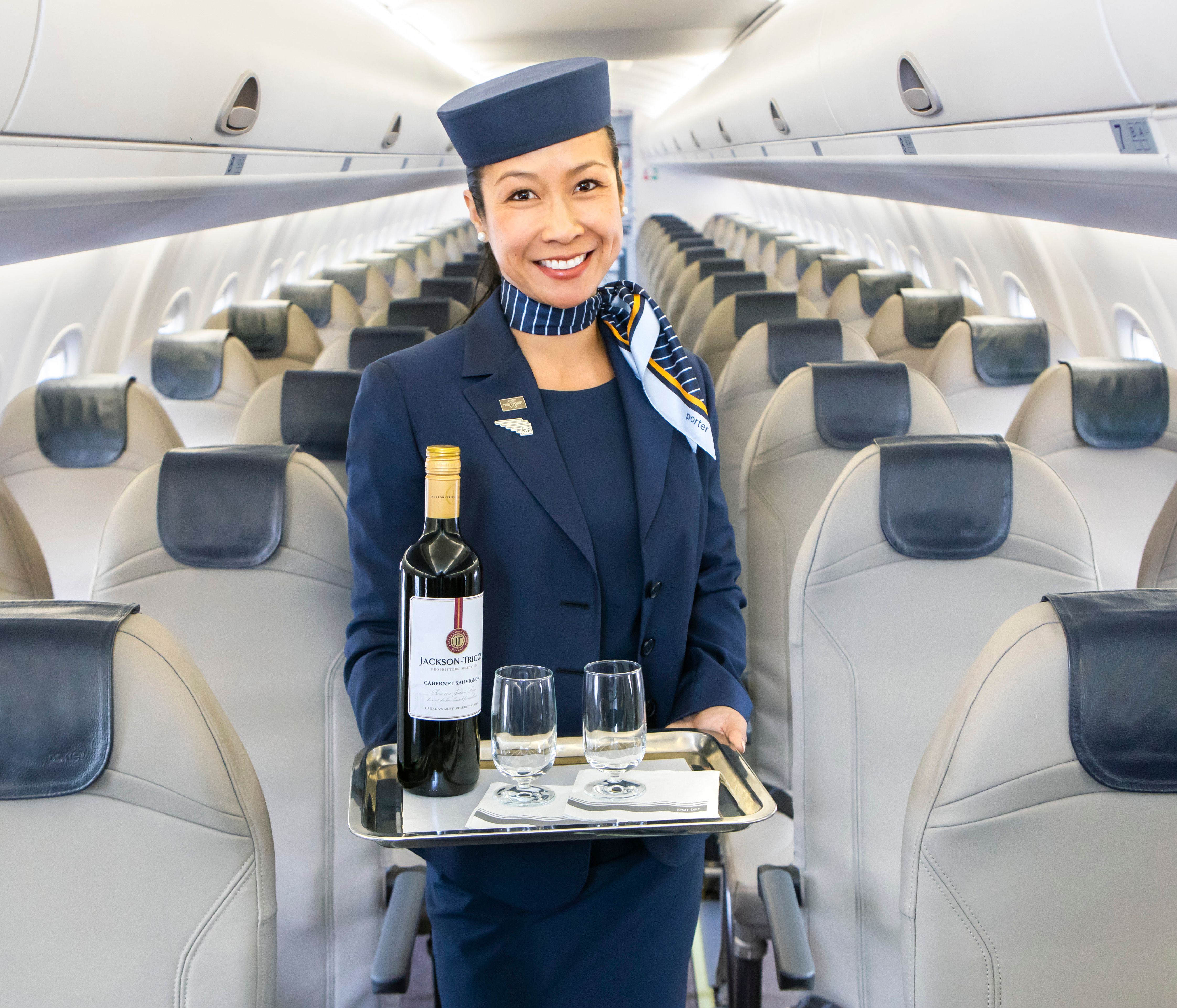 Onboard_3 - Porter Airlines Flight Attendant with Fine Wine and Glasses