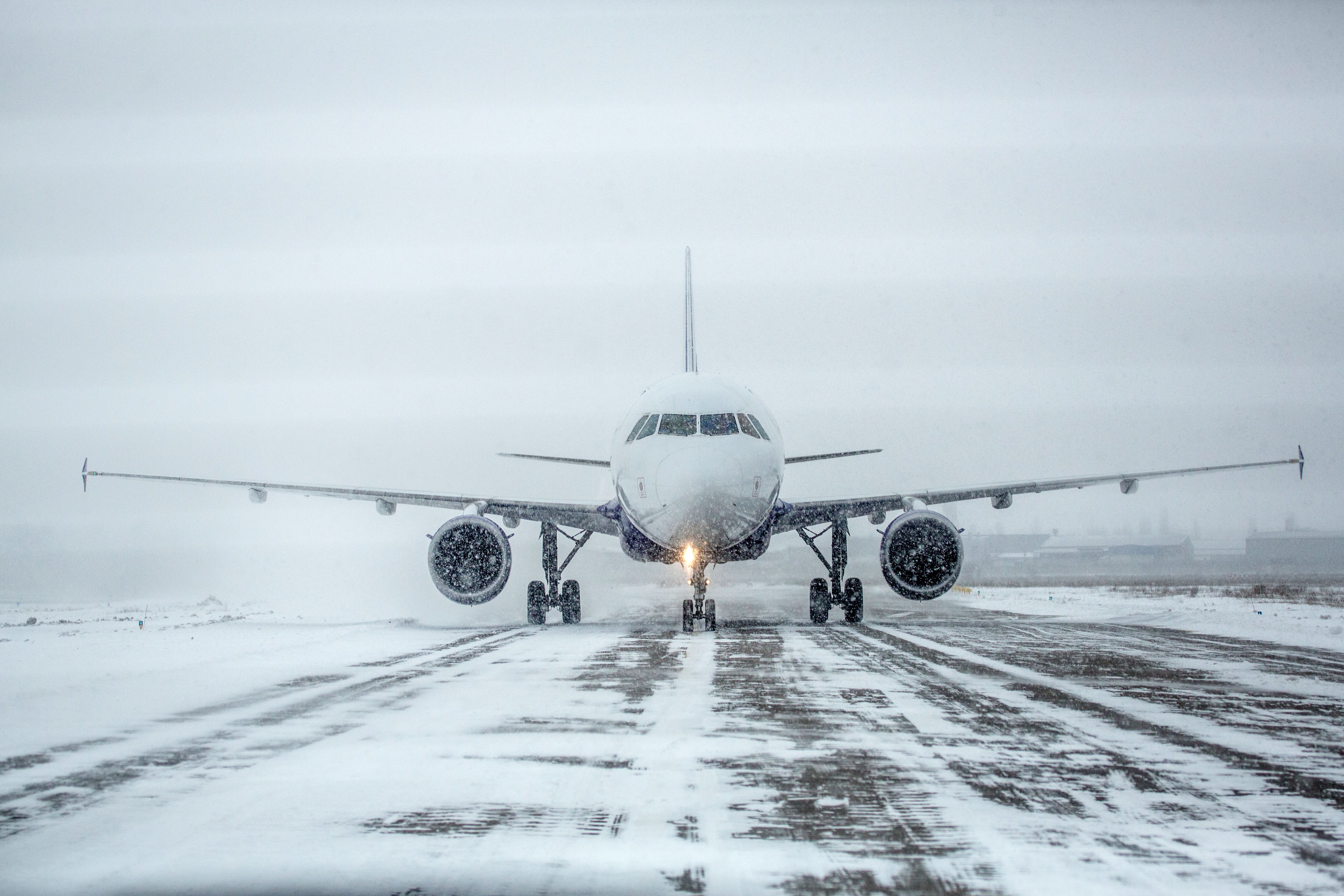 An Airbus aircraft taxiing in the snow