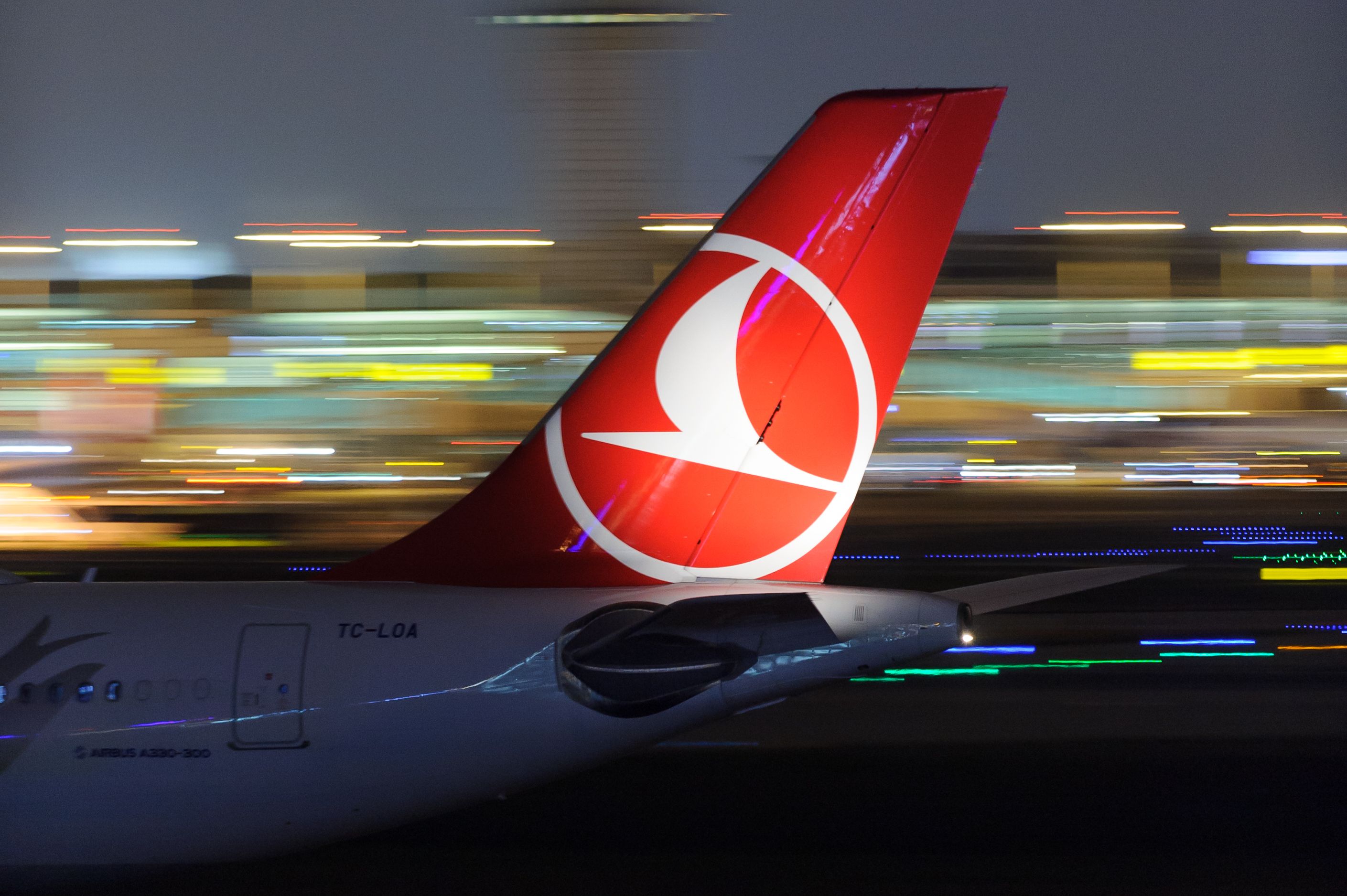 Turkish Airlines aircraft tail at night