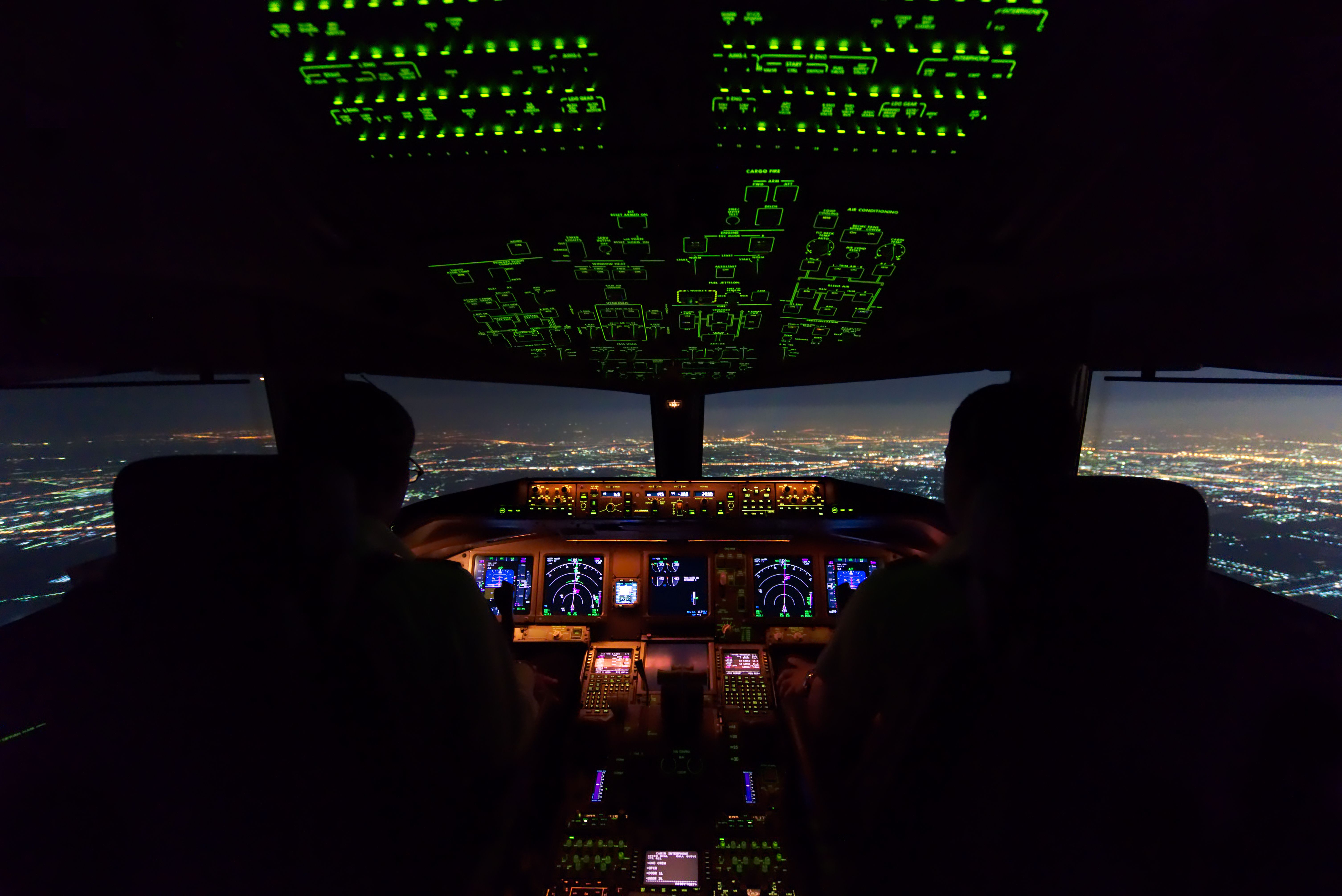 Inside A flight deck at night.