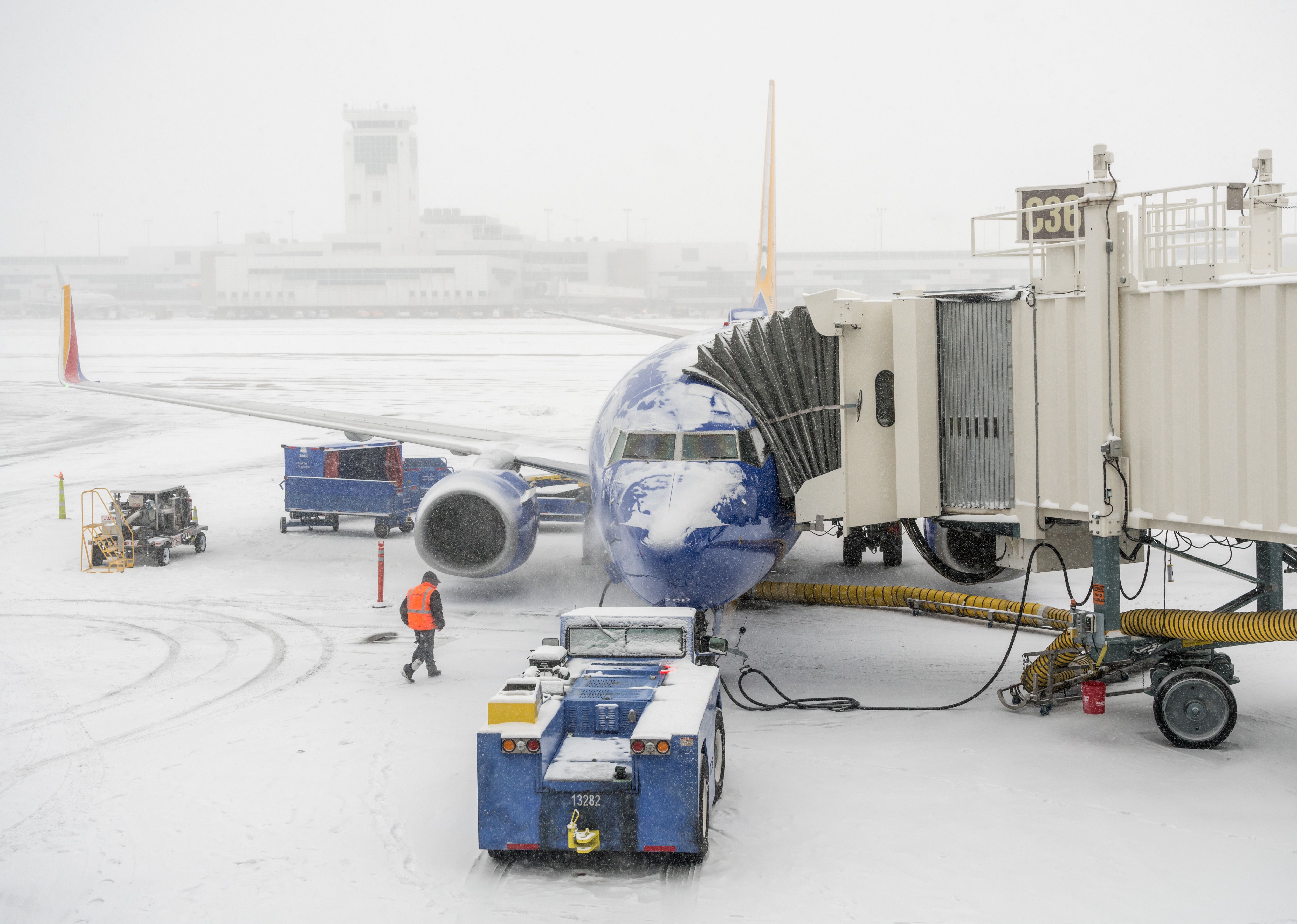 Denver, Colorado: January 24, 2019: Southwest Airlines loading onto the jetway in a snowstorm.