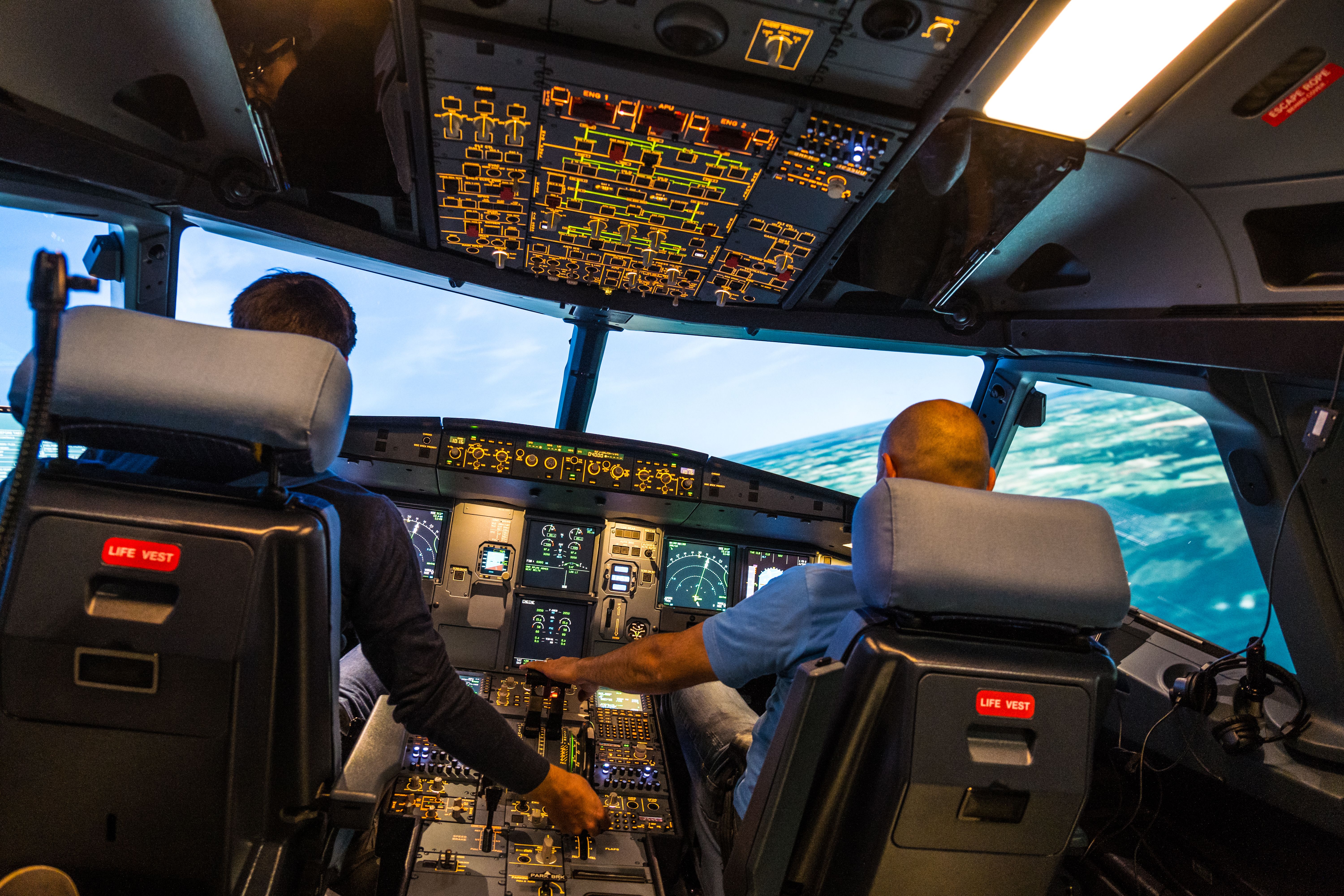 Pilots train in an aircraft flight simulator