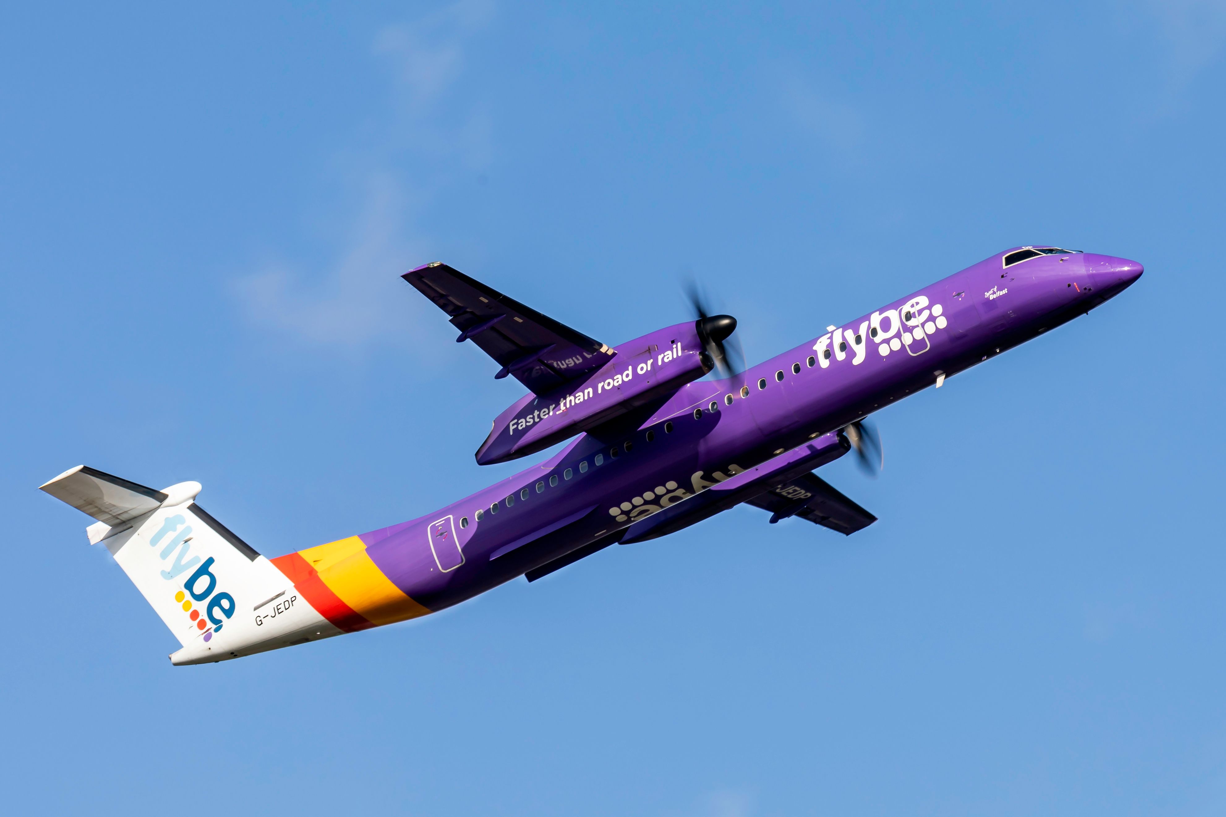 Flybe passenger aircraft G-JEDP a DHC 8Q, Dash 8 400 takes off from Birmingham Airport BHX
