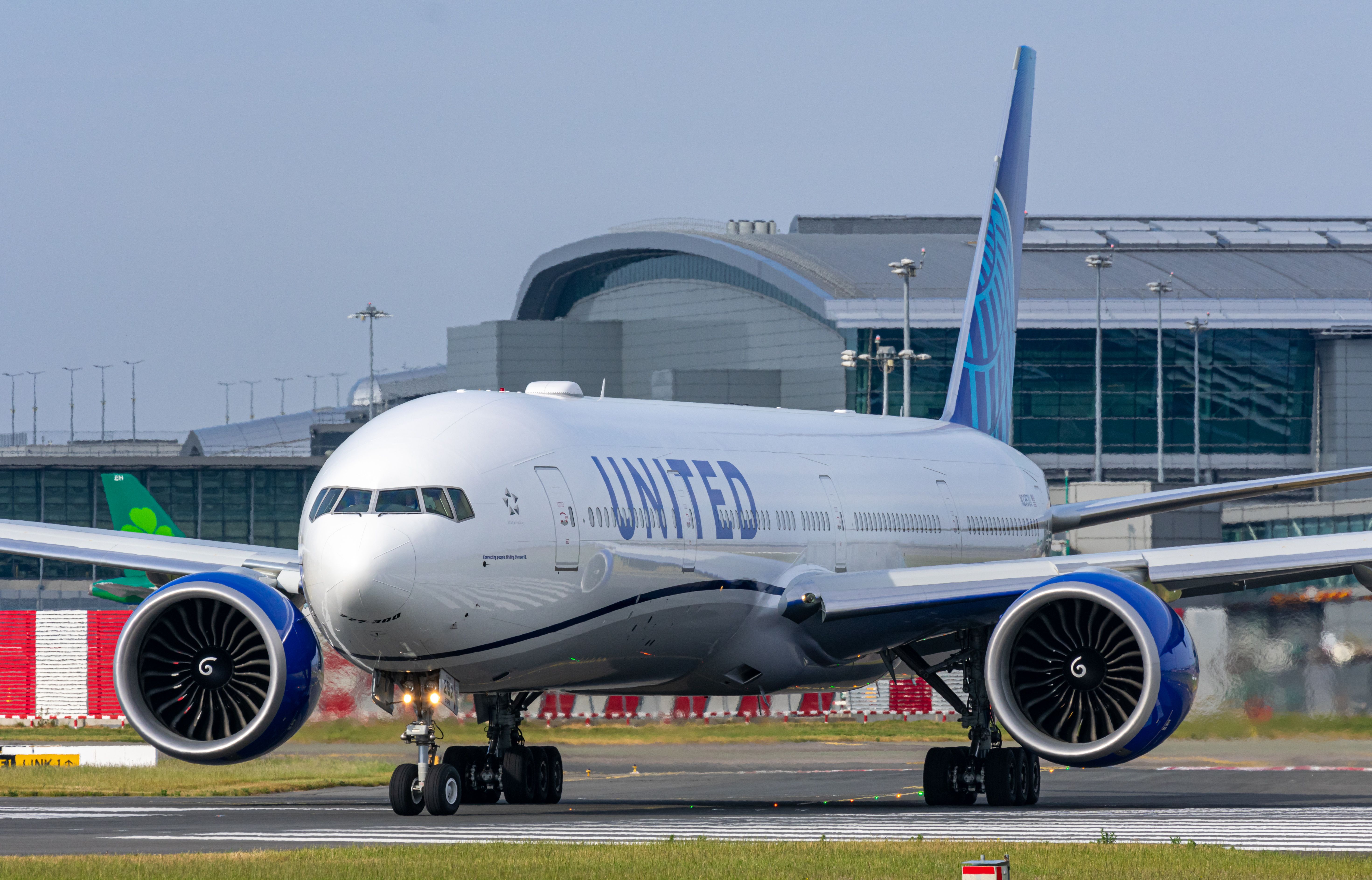 A United Airlines Boeing 777-300ER taxiing to the runway.
