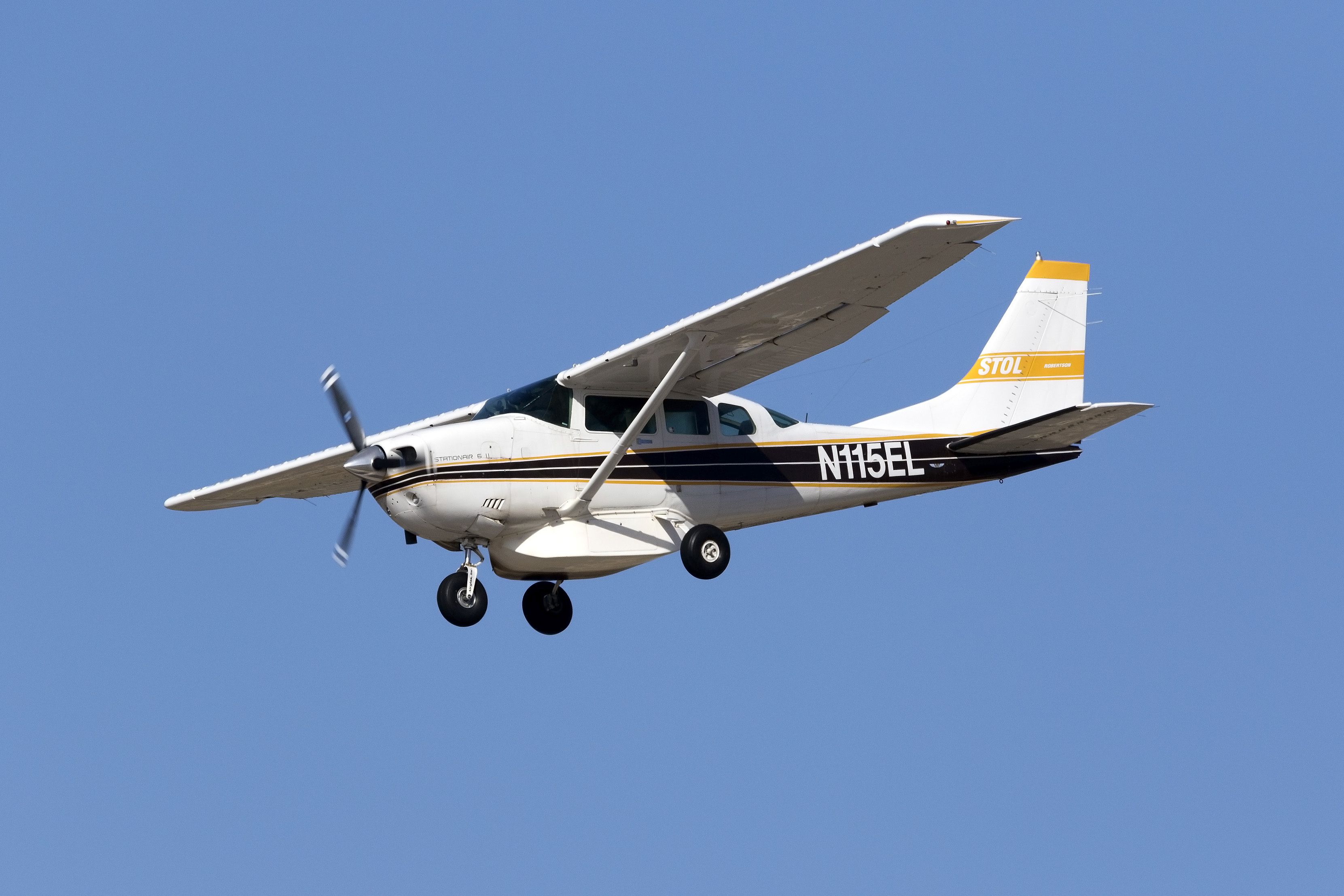 A Cessna T206H aircraft in flight.