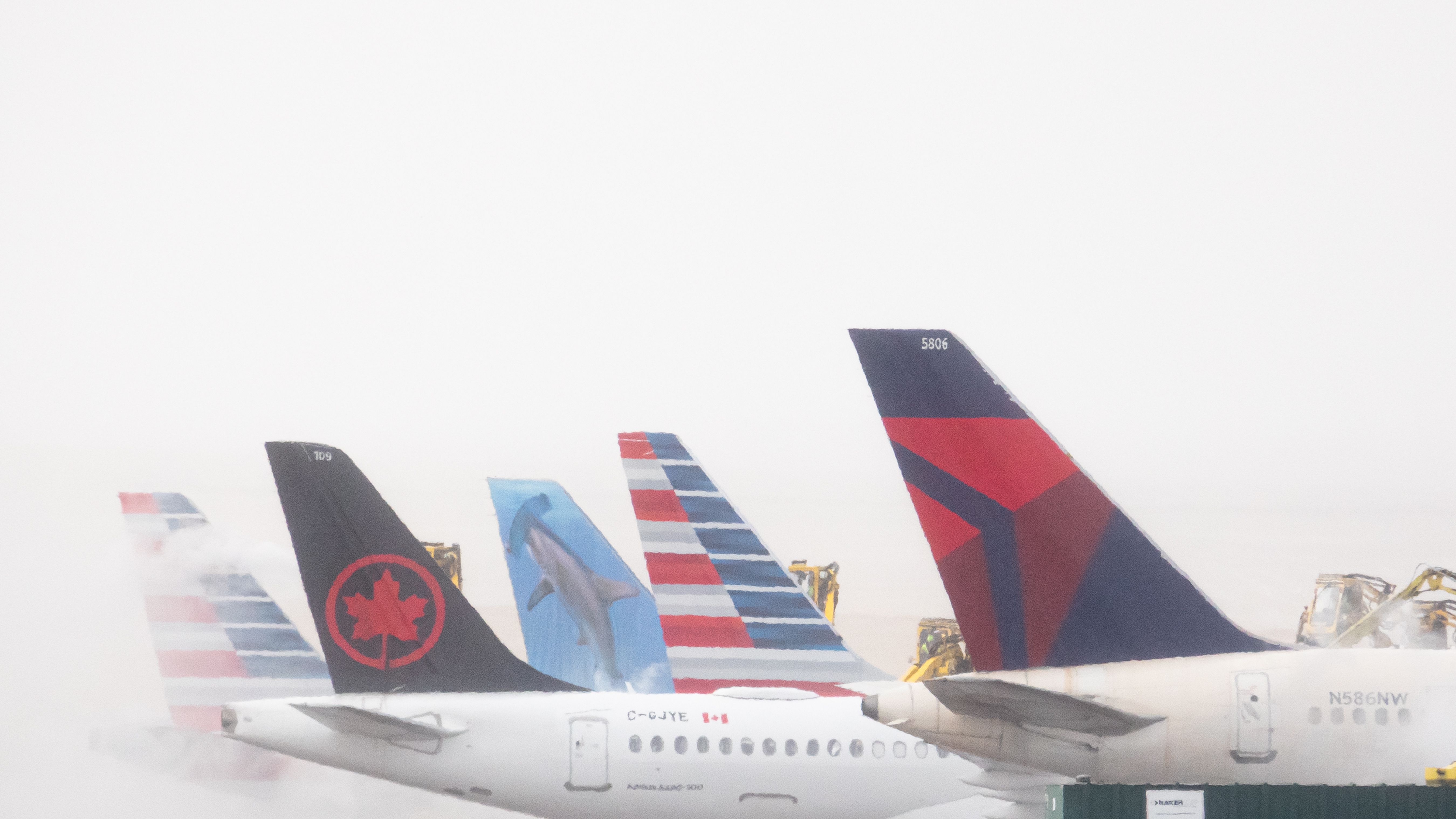 American Airlines, Air Canada Frontier, and Delta in the snow