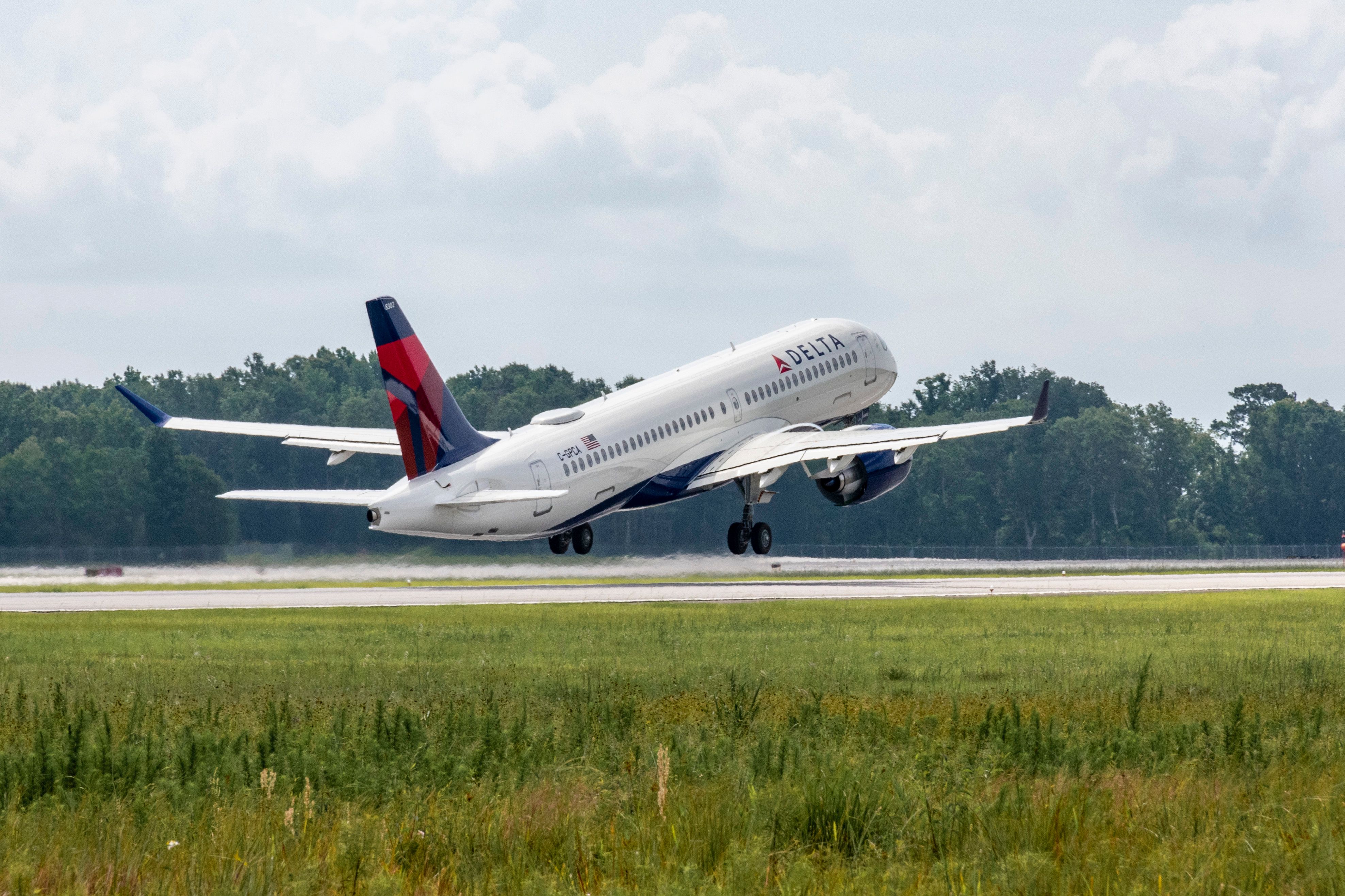 A Delta Air Lines Airbus A220 Taking off.