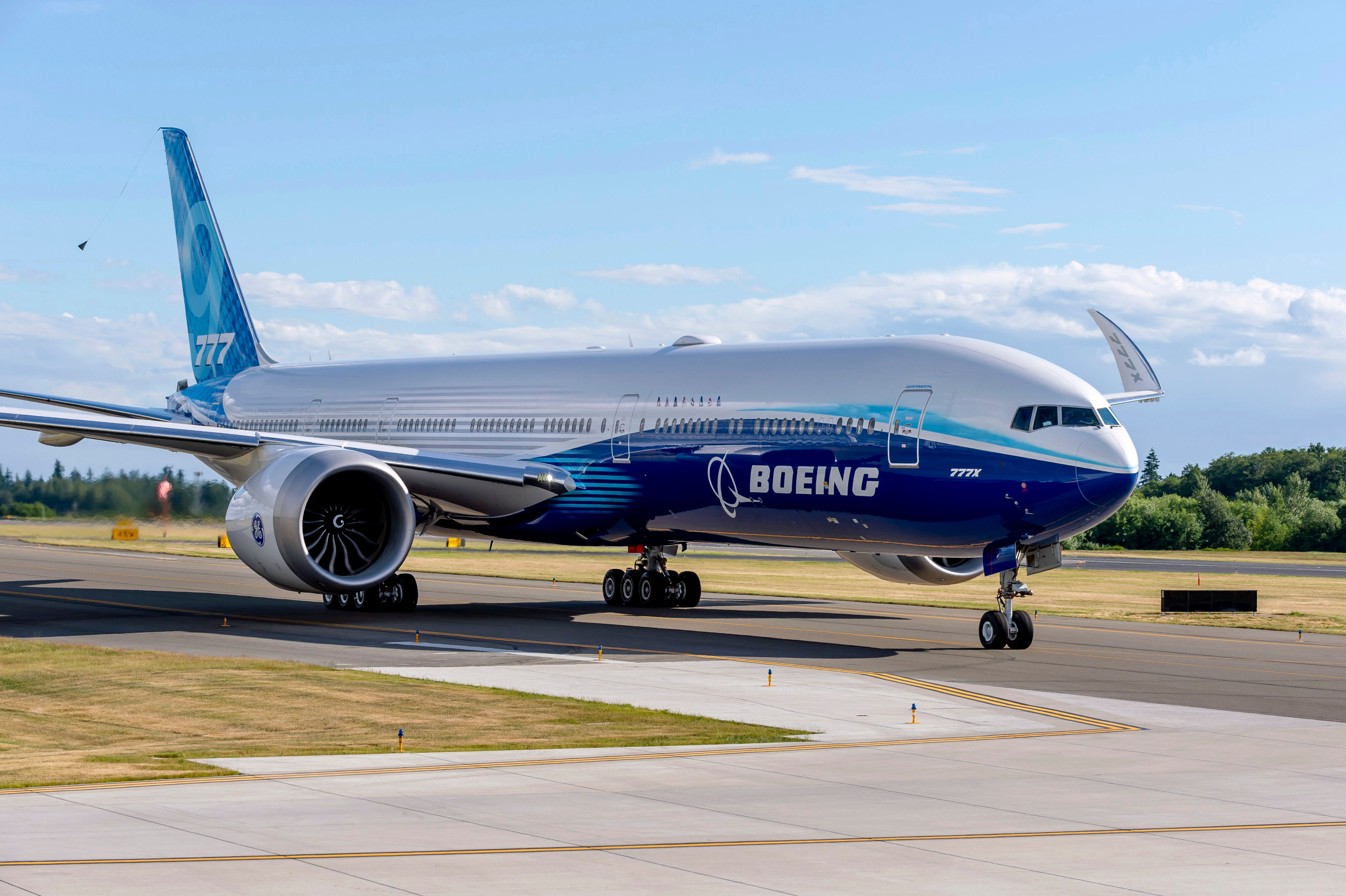 A Boeing 777X taxiing to the runway.