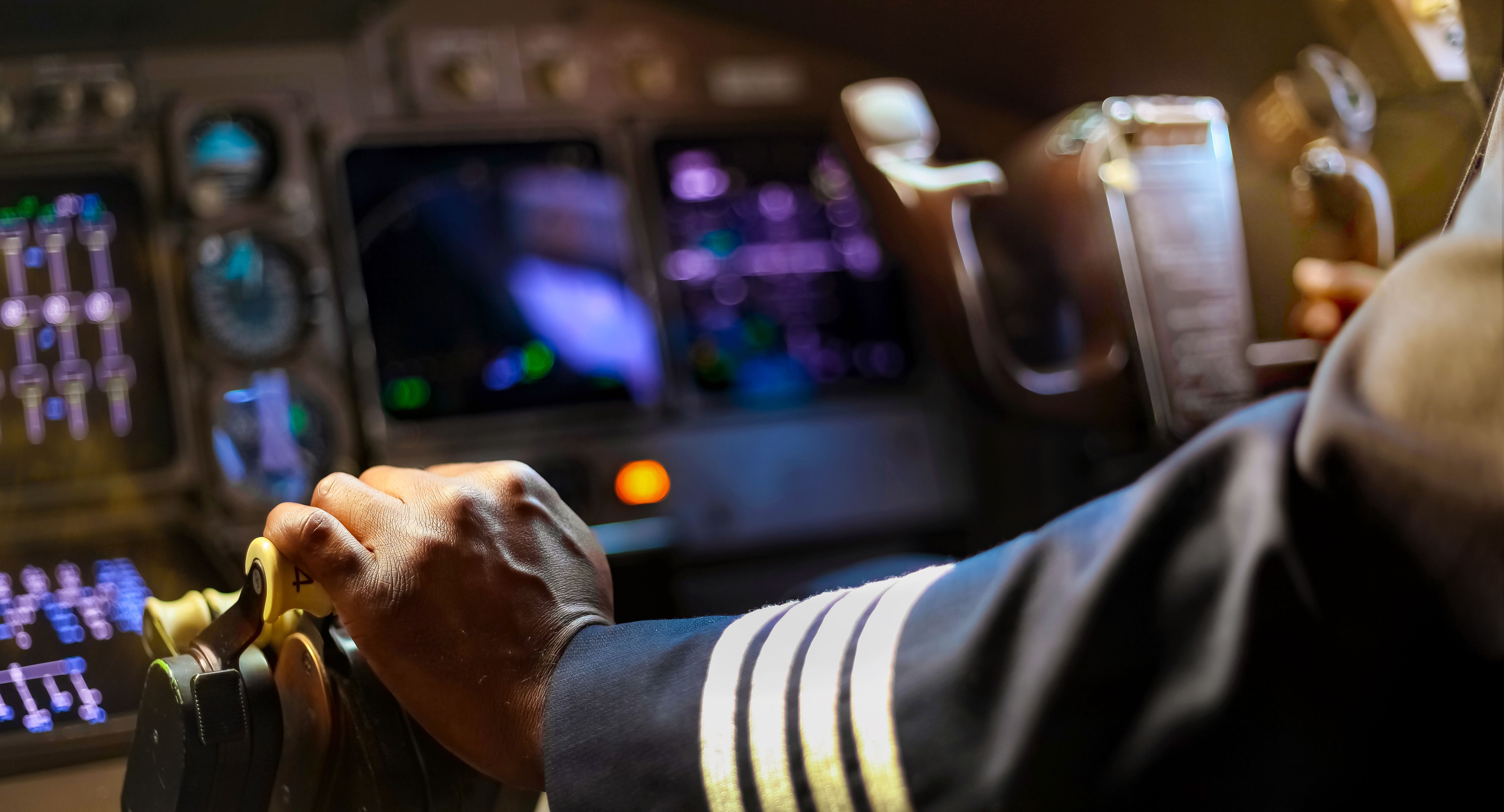 In safe hands, a pilot navigates the trust levers of a Boeing 747.