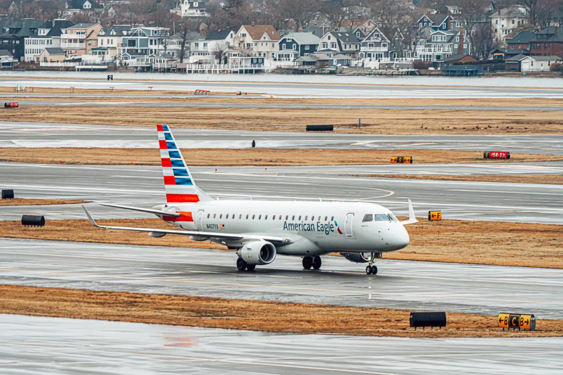 An American Airlines Embraer E175 on the taxiway.