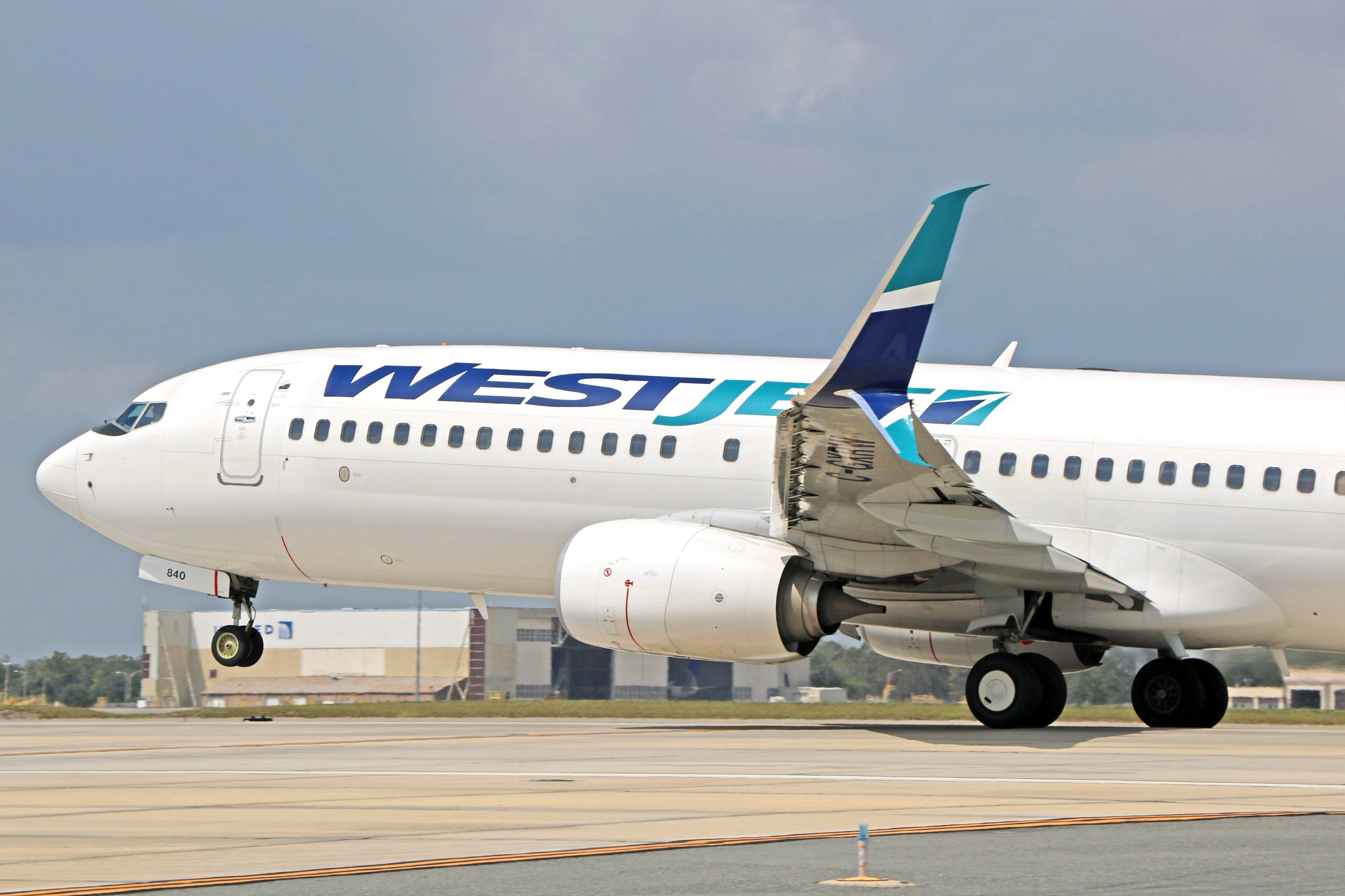 WestJet Boeing 737 landing at Orlando International Airport.