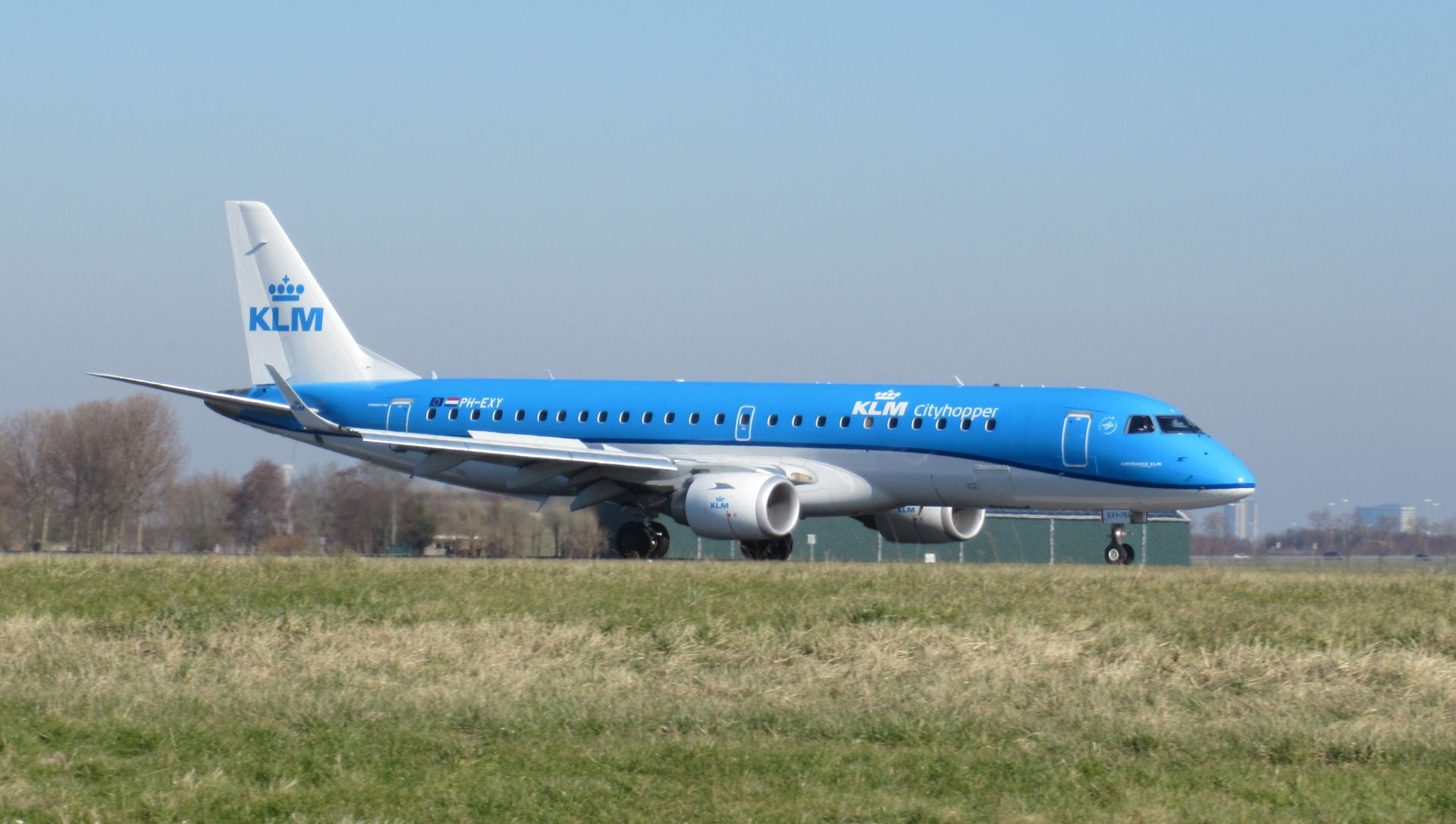 A KLM Cityhopper Embraer 190STD taxiing to the runway.