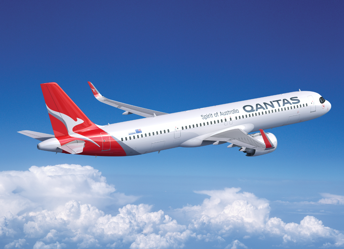 A Qantas Airbus A321XLR flying above the clouds.