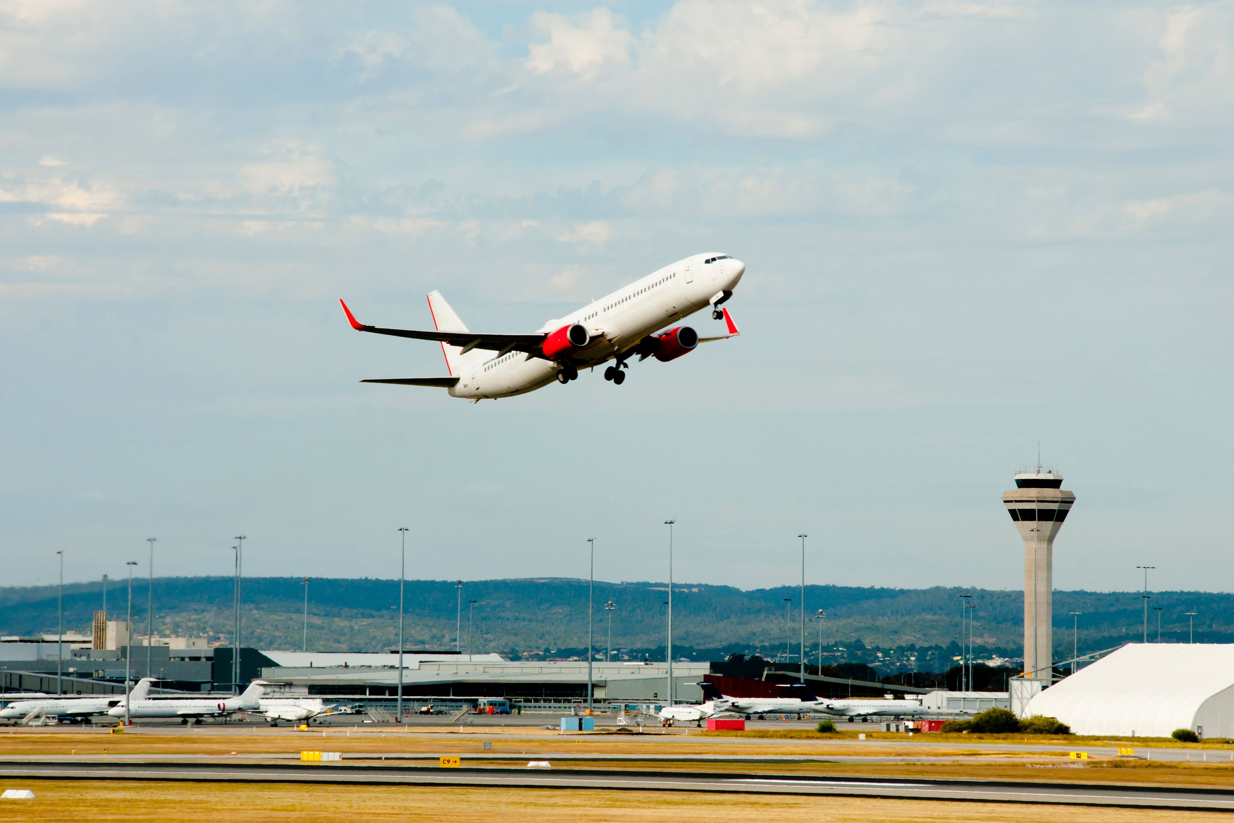 Airplane Taking off by ATC Tower at Perth Airport