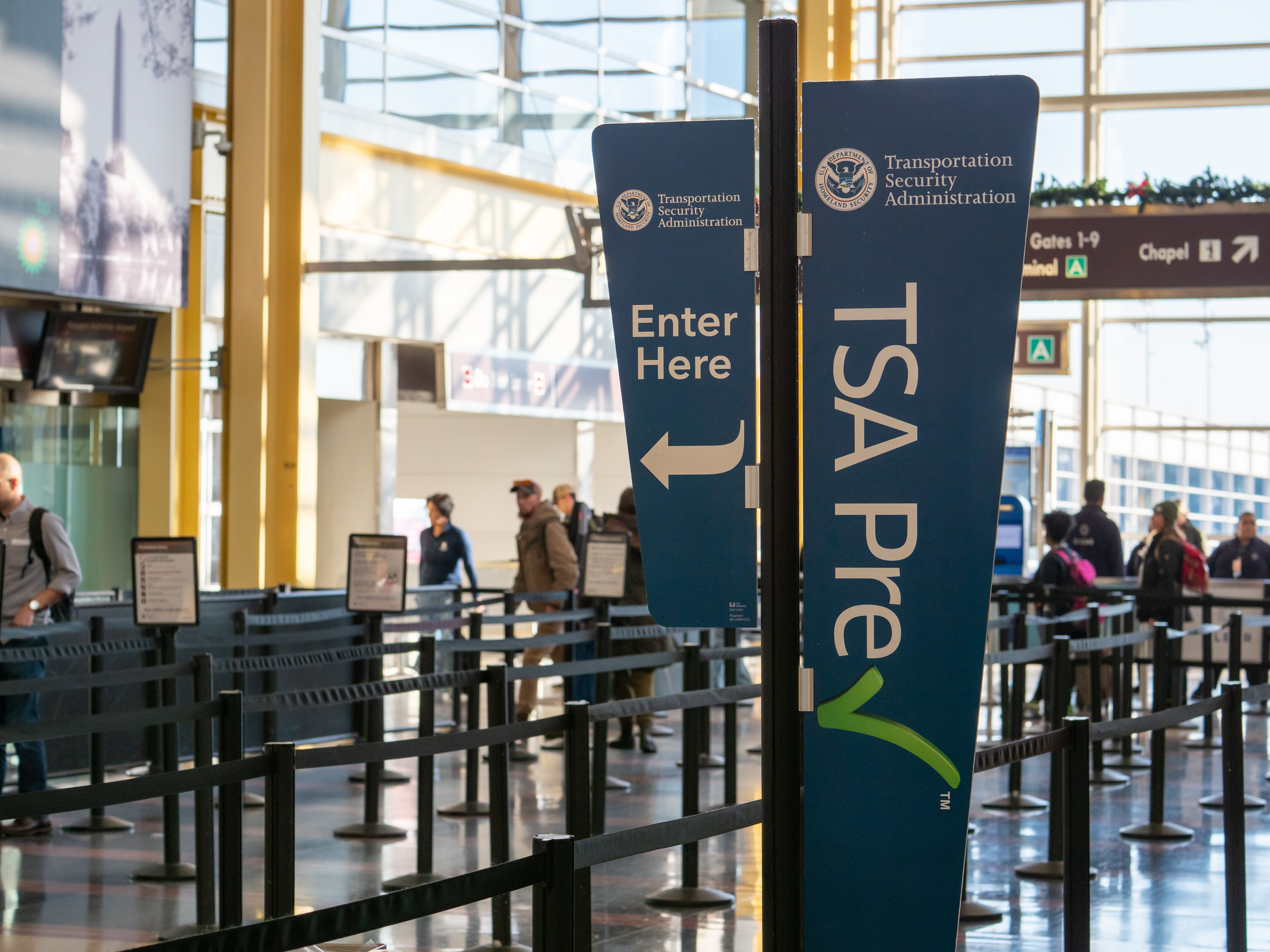A TSA PreCheck sign and lane at Reagan National Airport.