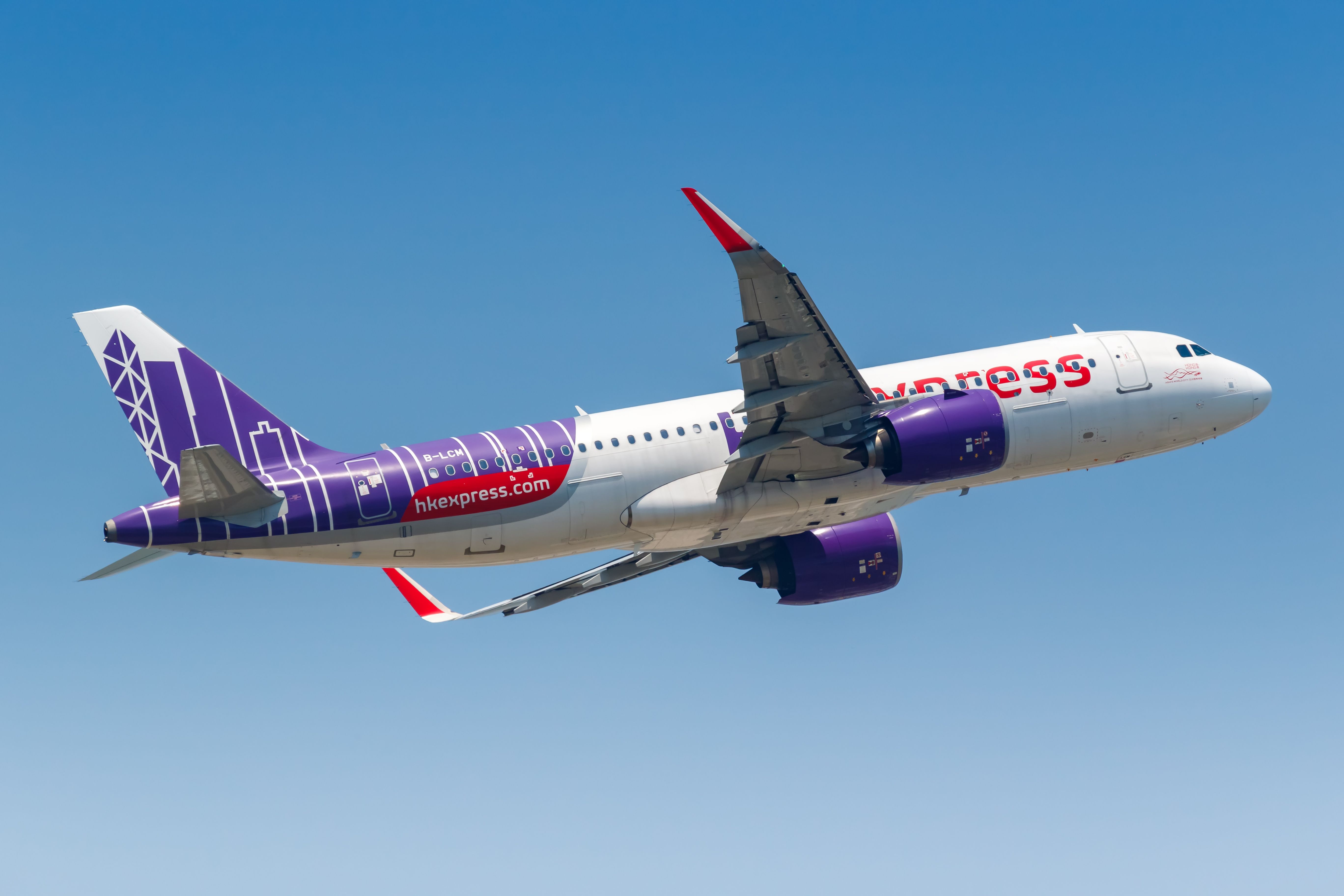 A HK Express Airbus A320neo flying in the sky.