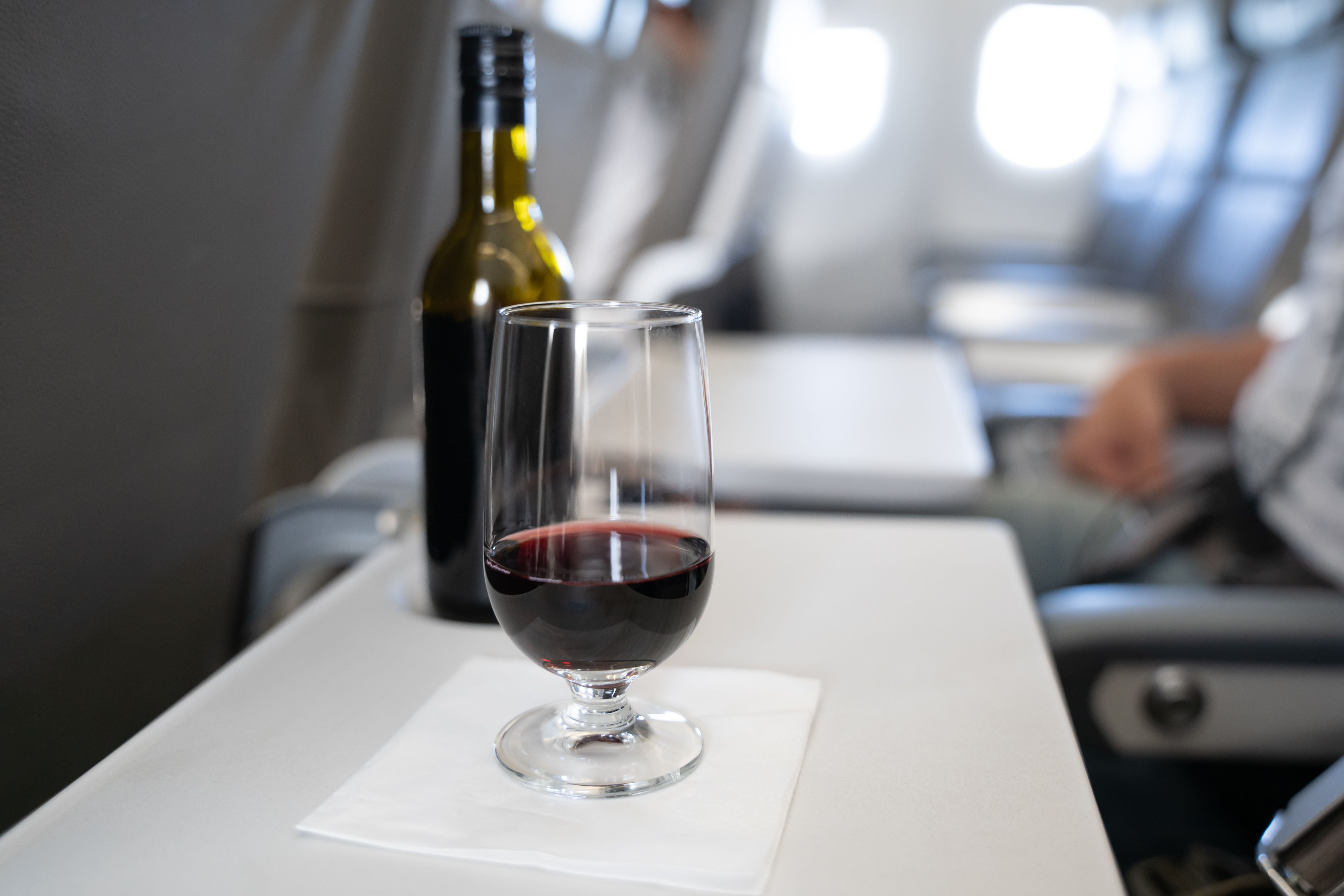 A glass of wine onboard an aircraft