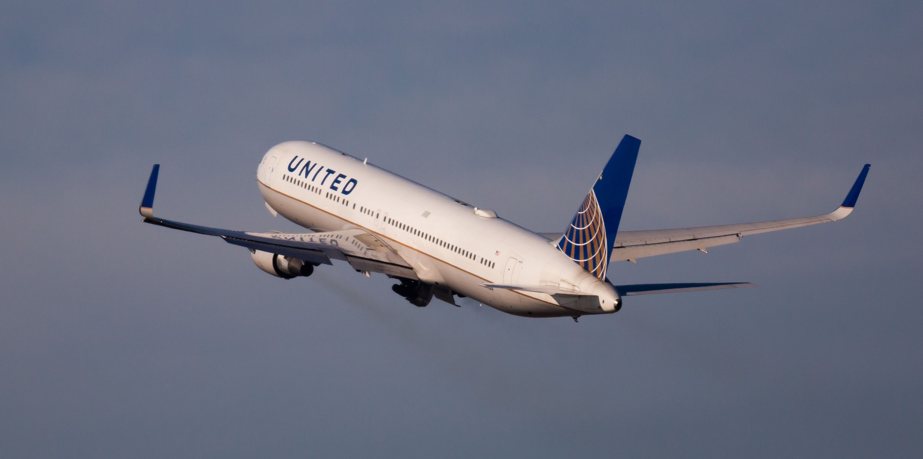 View of N641UA Boeing 767-322(ER) of United Airlines flies up from Barcelona Airport (BCN)