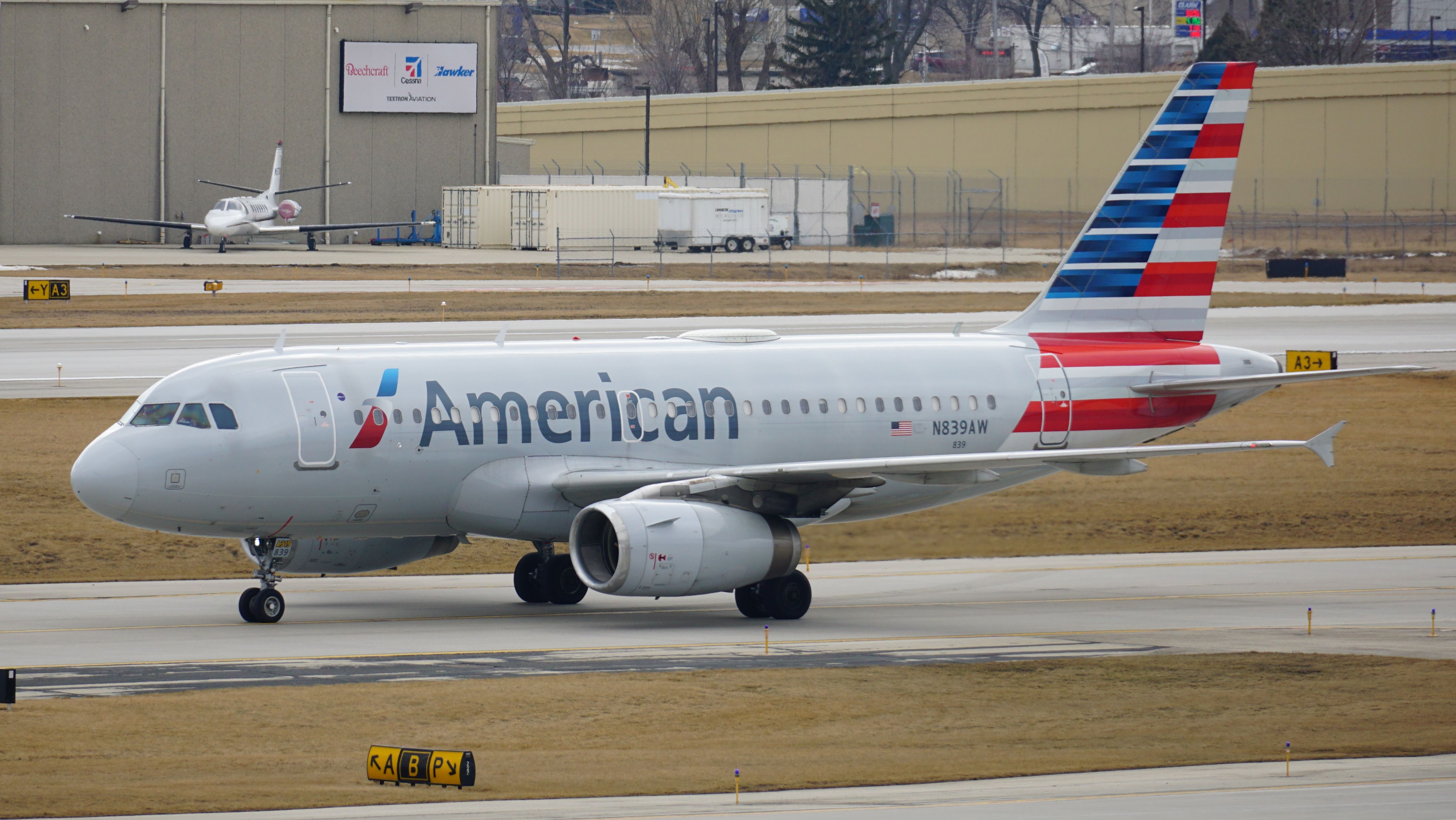 An American Airlines Airbus A319 taxis on the runway after landing at Milwaukee General Mitchell International Airport.