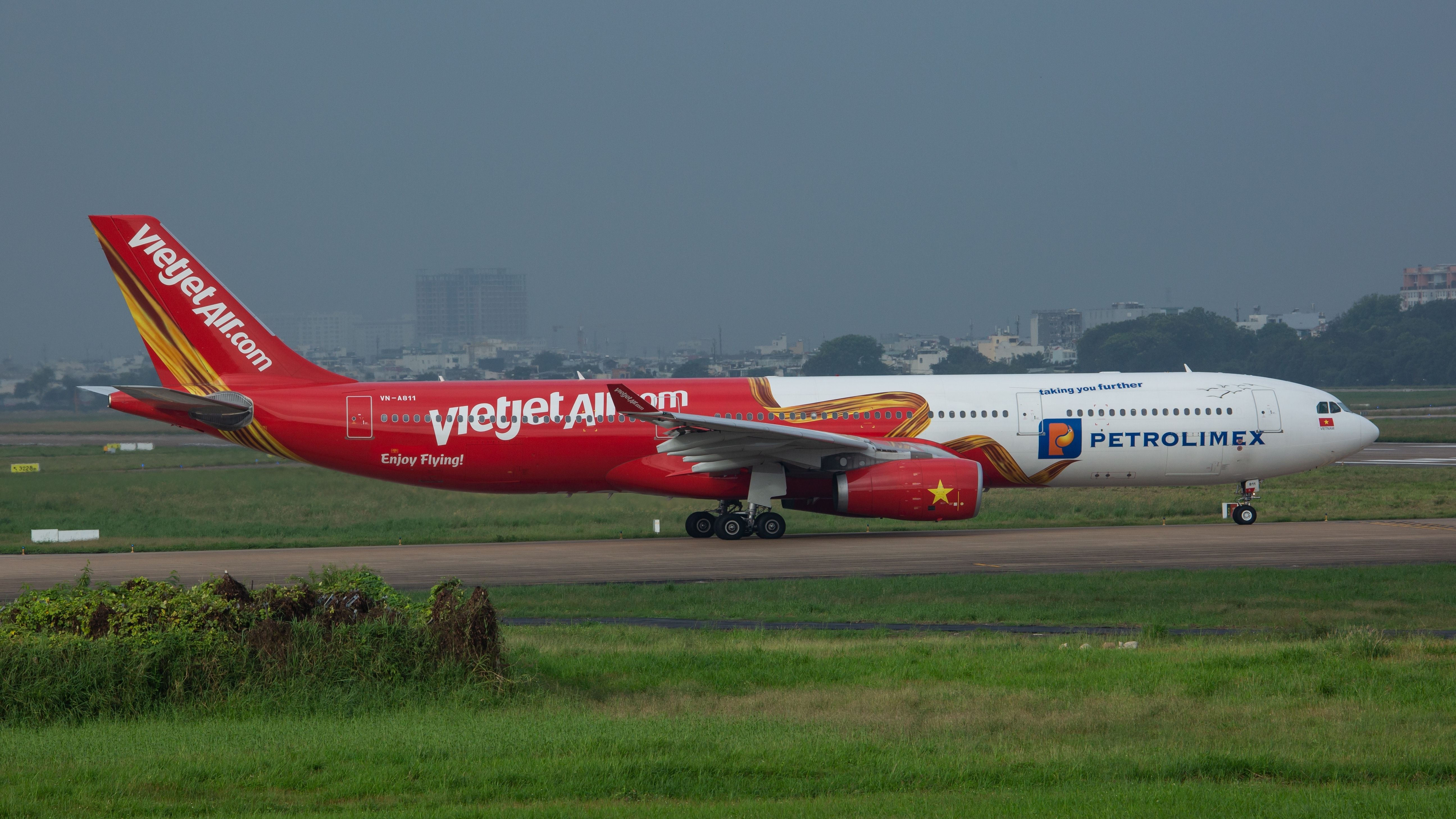 Airbus A330 of VietJet Air with registration VN-A811 with Petrolimex livery prepare for take off at Tan Son Nhat international airport.