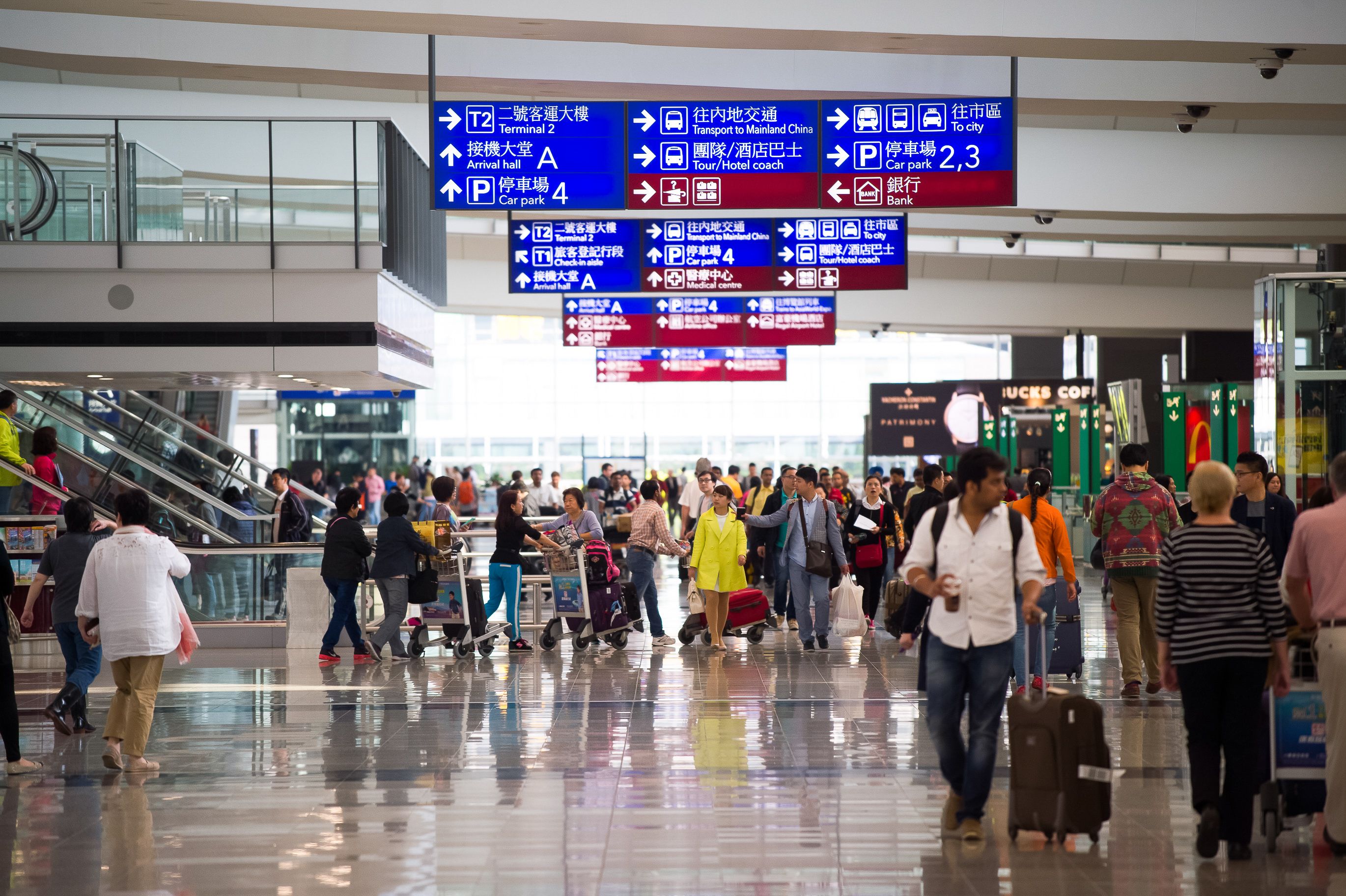 hong kong airport terminal with passengers walking
