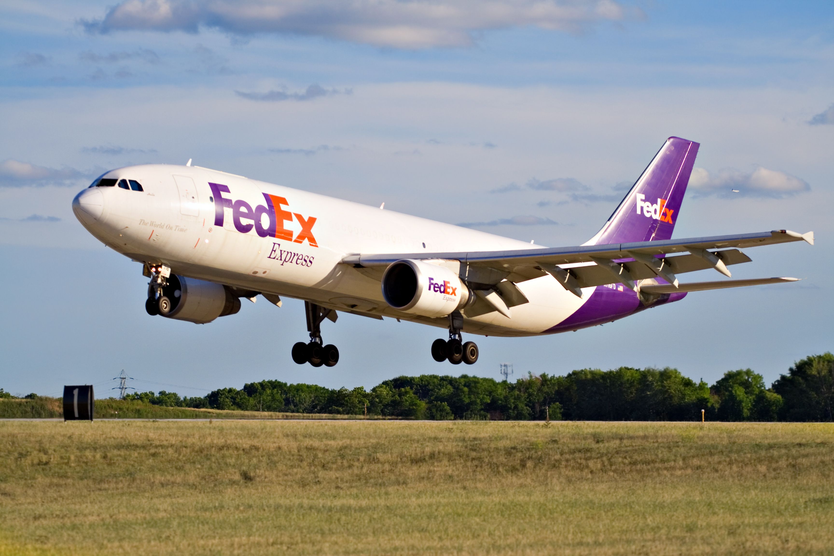 FedEx aircraft landing on runway