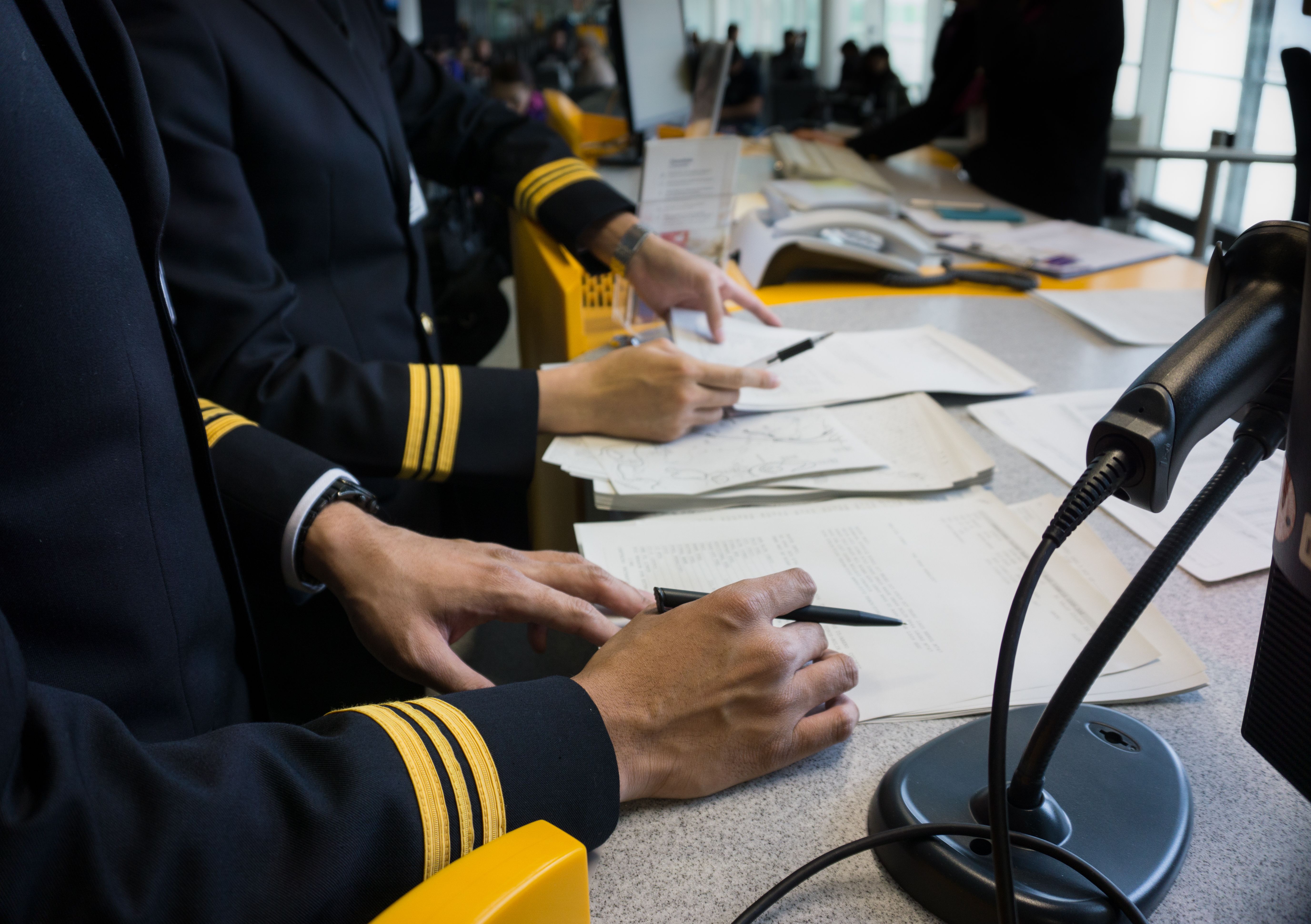 Pilots reviewing preflight documents.