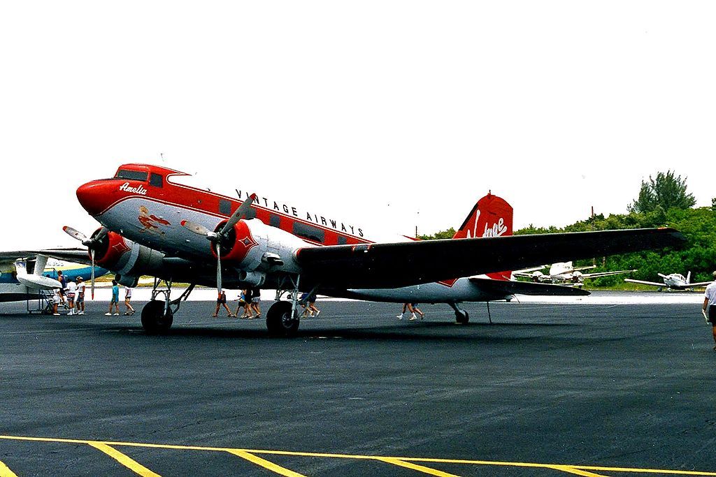 1024px-N21_Douglas_DC-3_Vintage_Aws-Virgin_EYW_03JUN94_(5550564317)