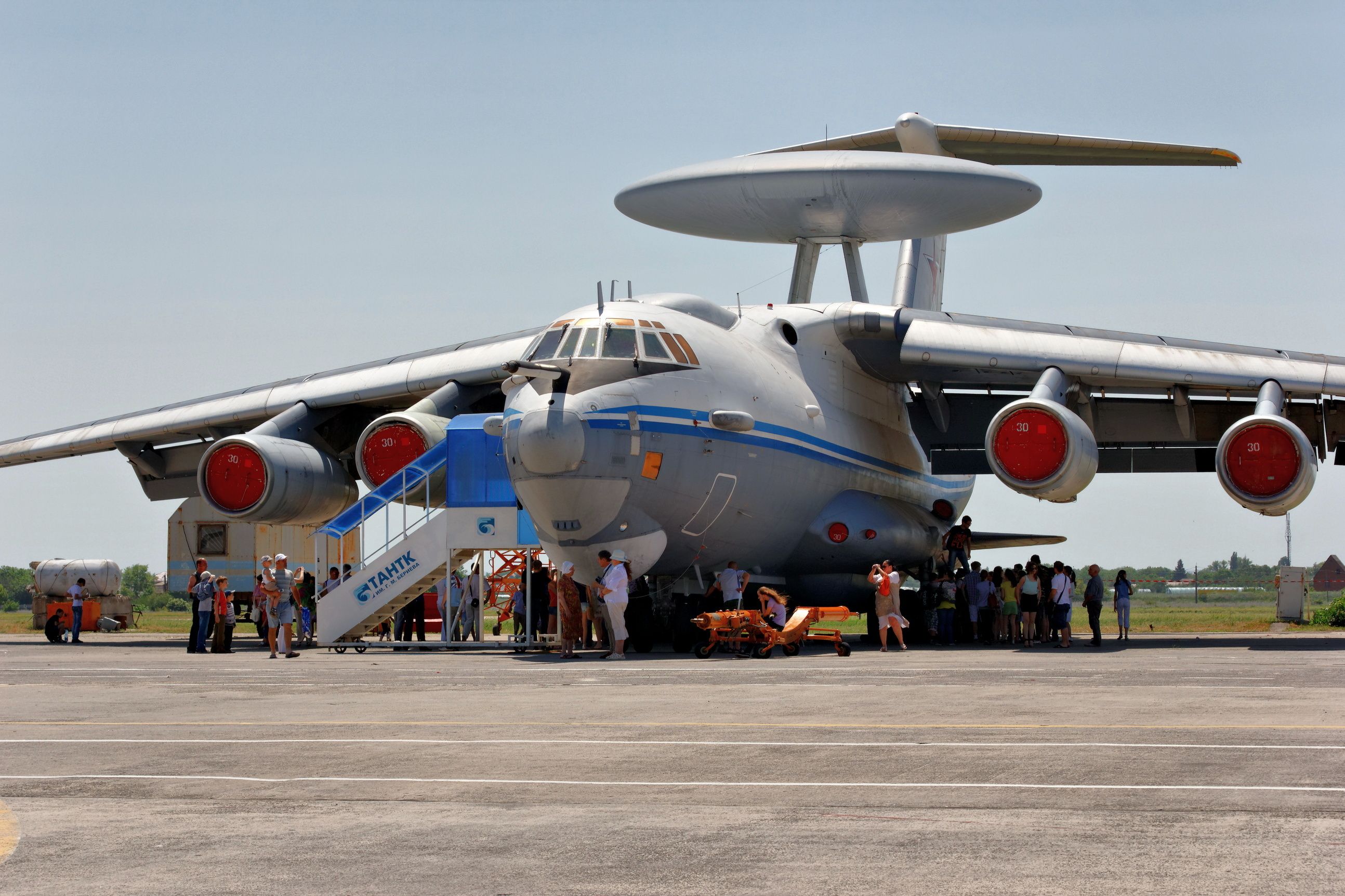 A Beriev A-50 aircraft parked at an airfield, with many visitors taking photos.