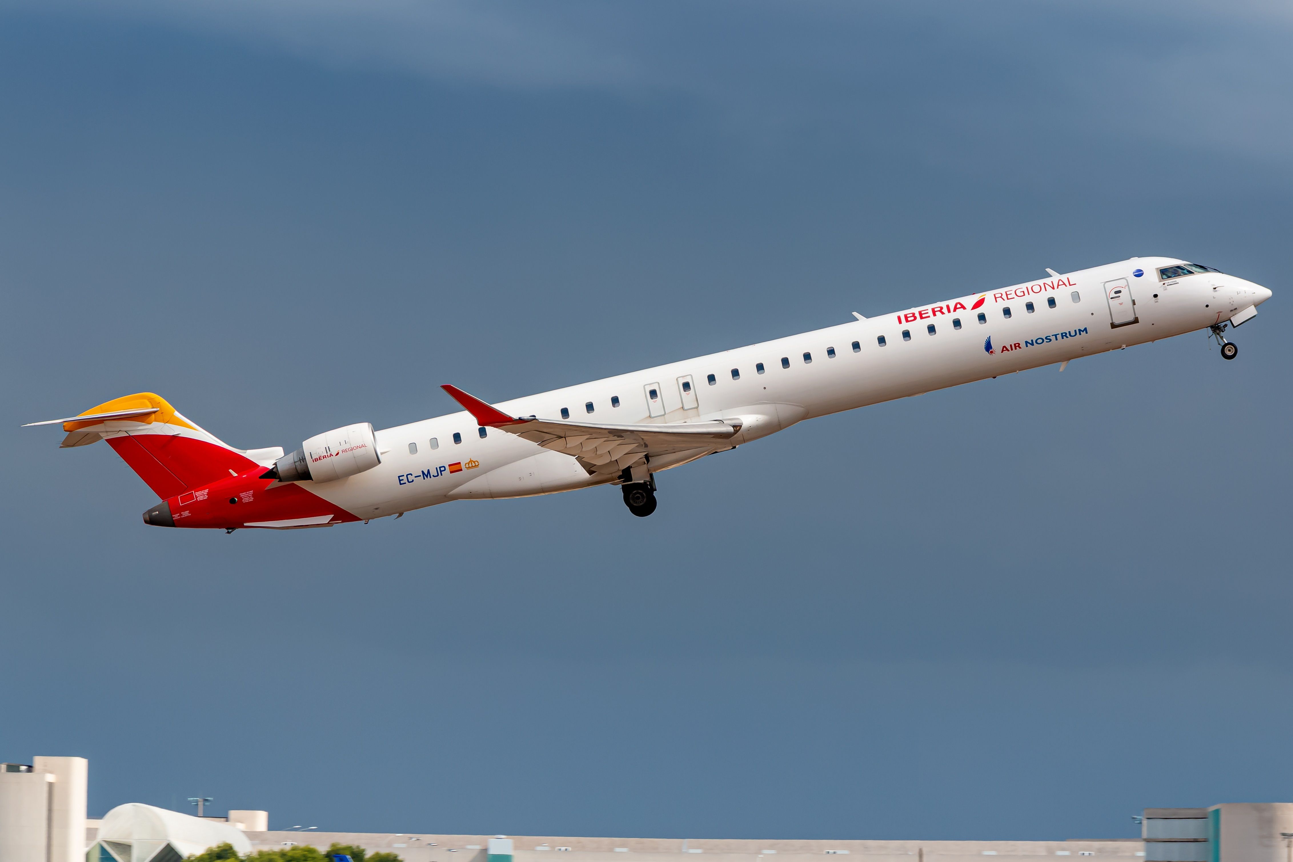 An Air Nostrum CRJ 1000 Flying in the sky.