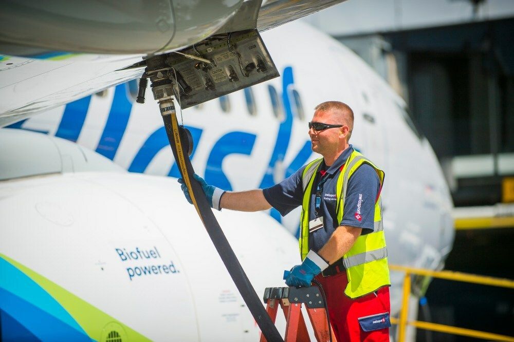 Alaska Airlines aircraft being fueled by Shell employee