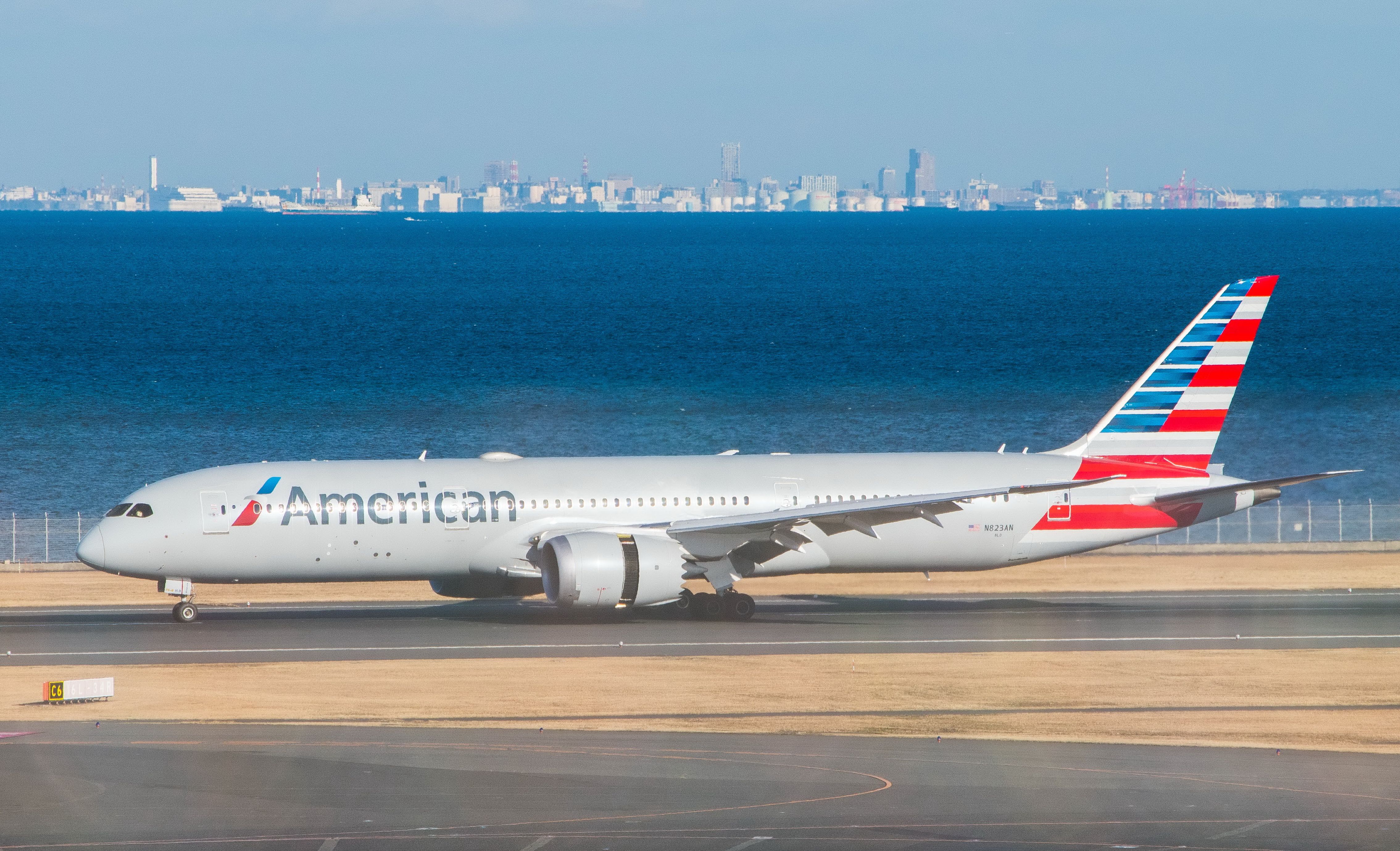 An American Airlines Boeing 787 Dreamliner taxiing to the runway.