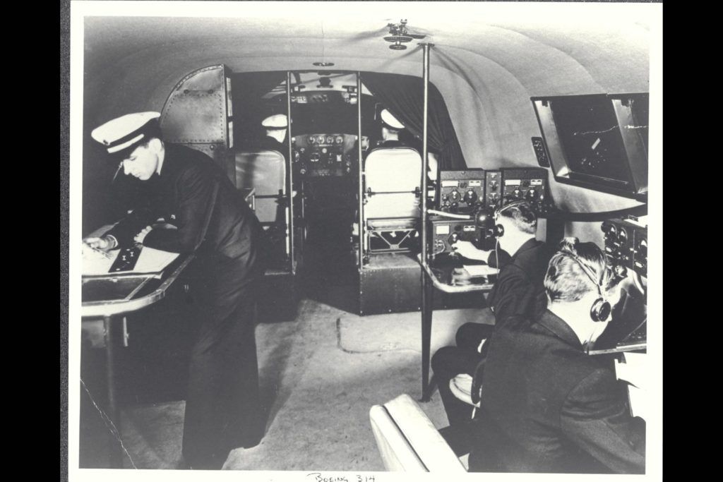 Crew members in side a Pan Am flying boat.