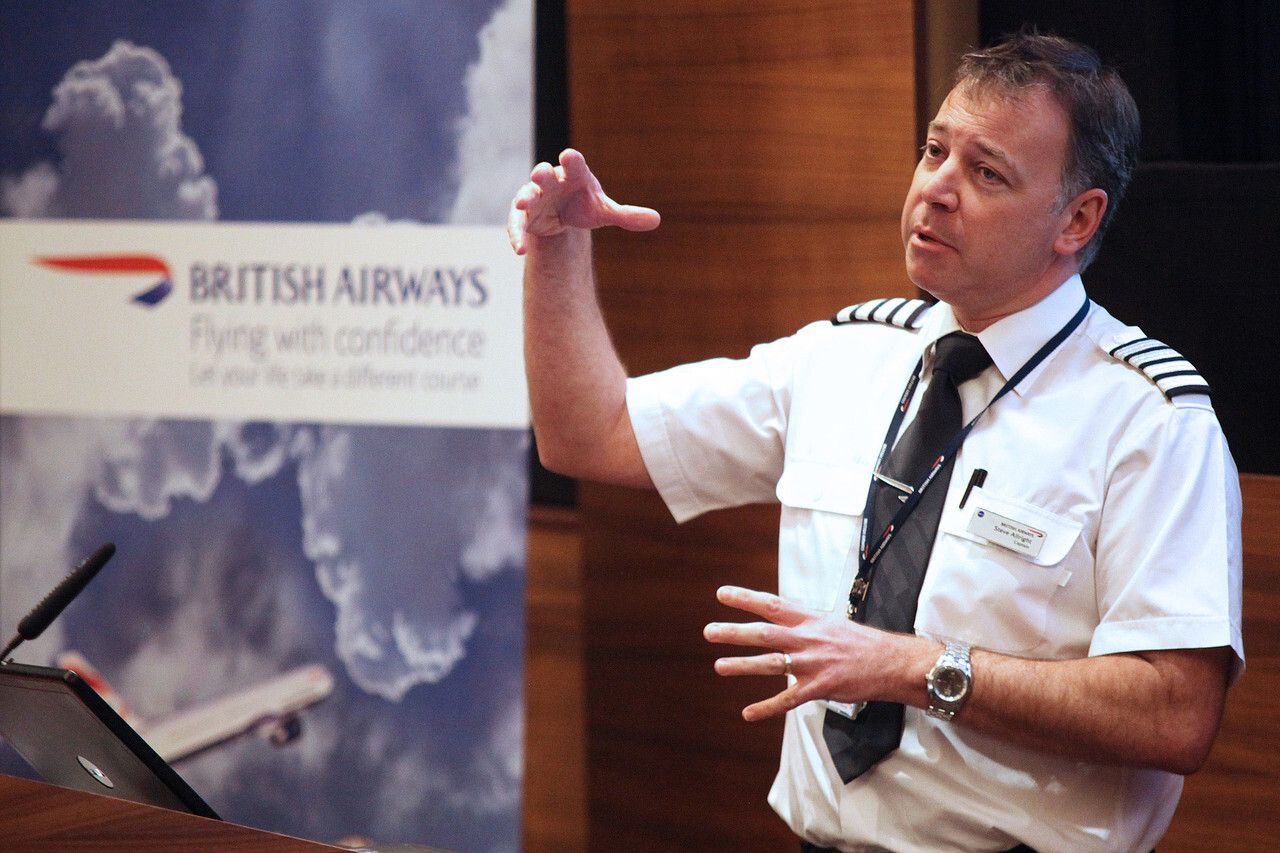 A British Airways pilot giving a speech.