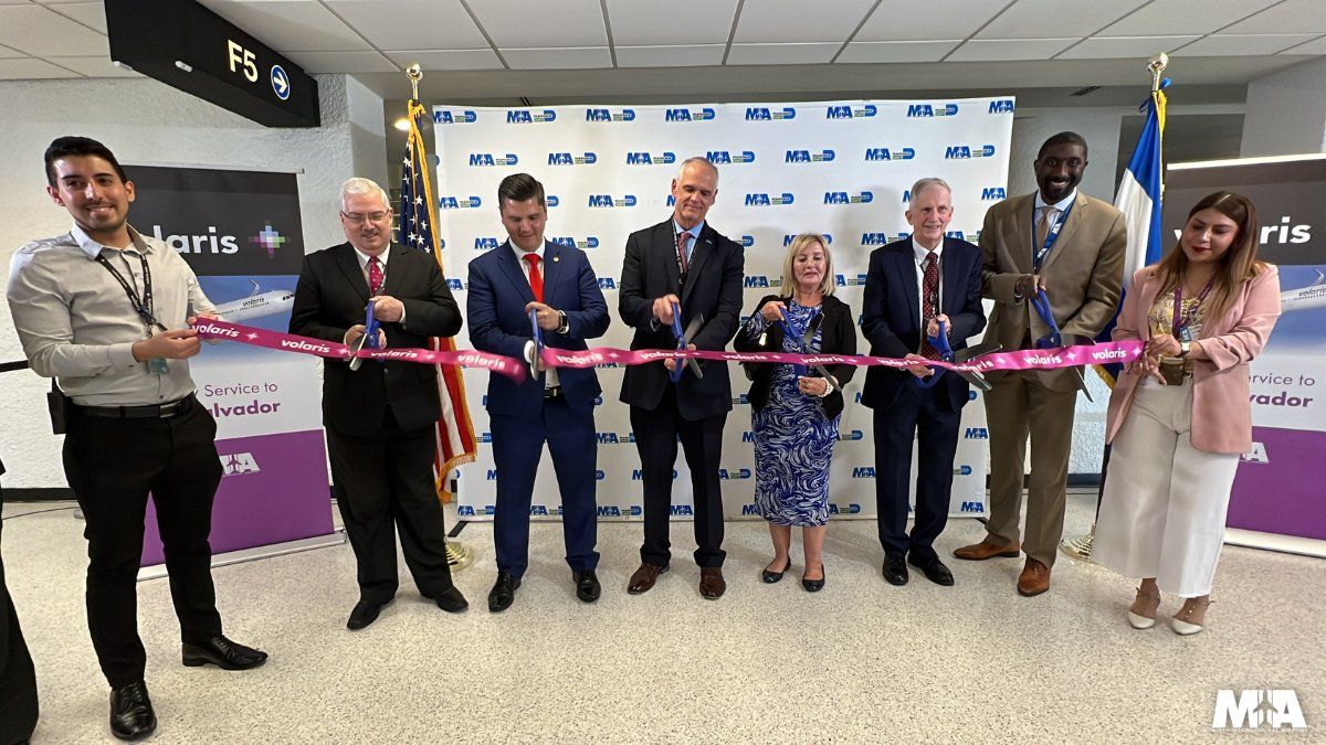 Ribbon-cutting ceremony celebrating Volaris El Salvador launching new flights at Miami International Airport.