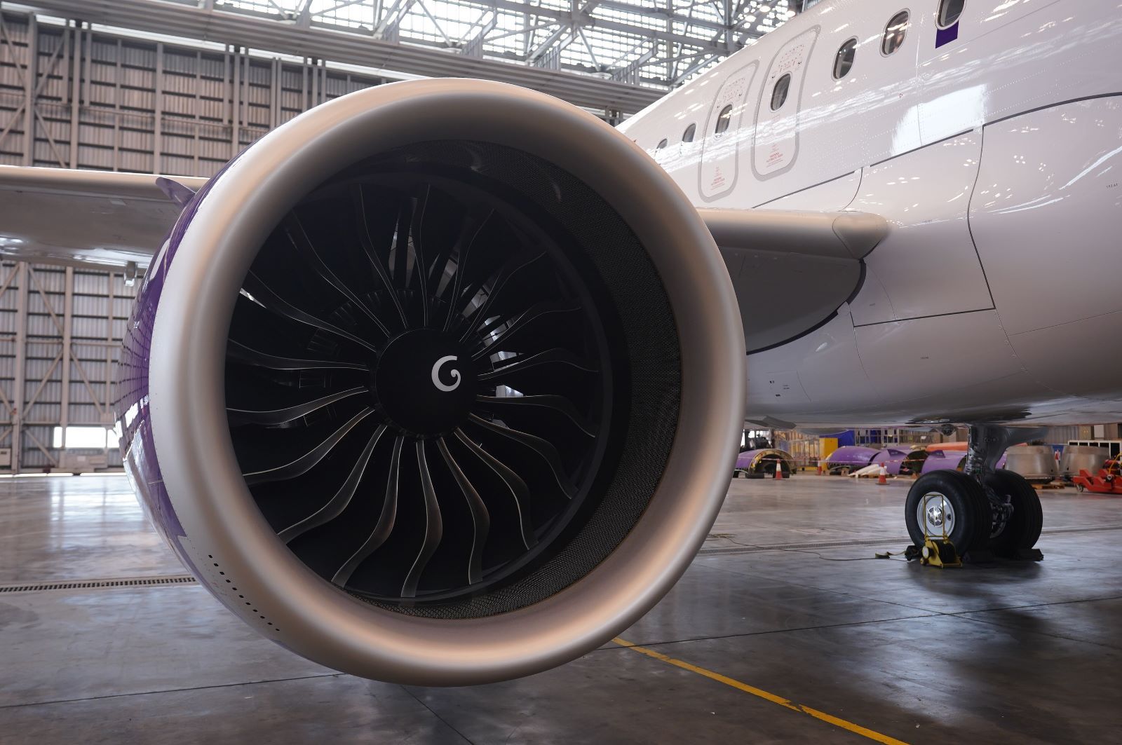 A HK Express aircraft, zoomed in on the CFM Leap engine.
