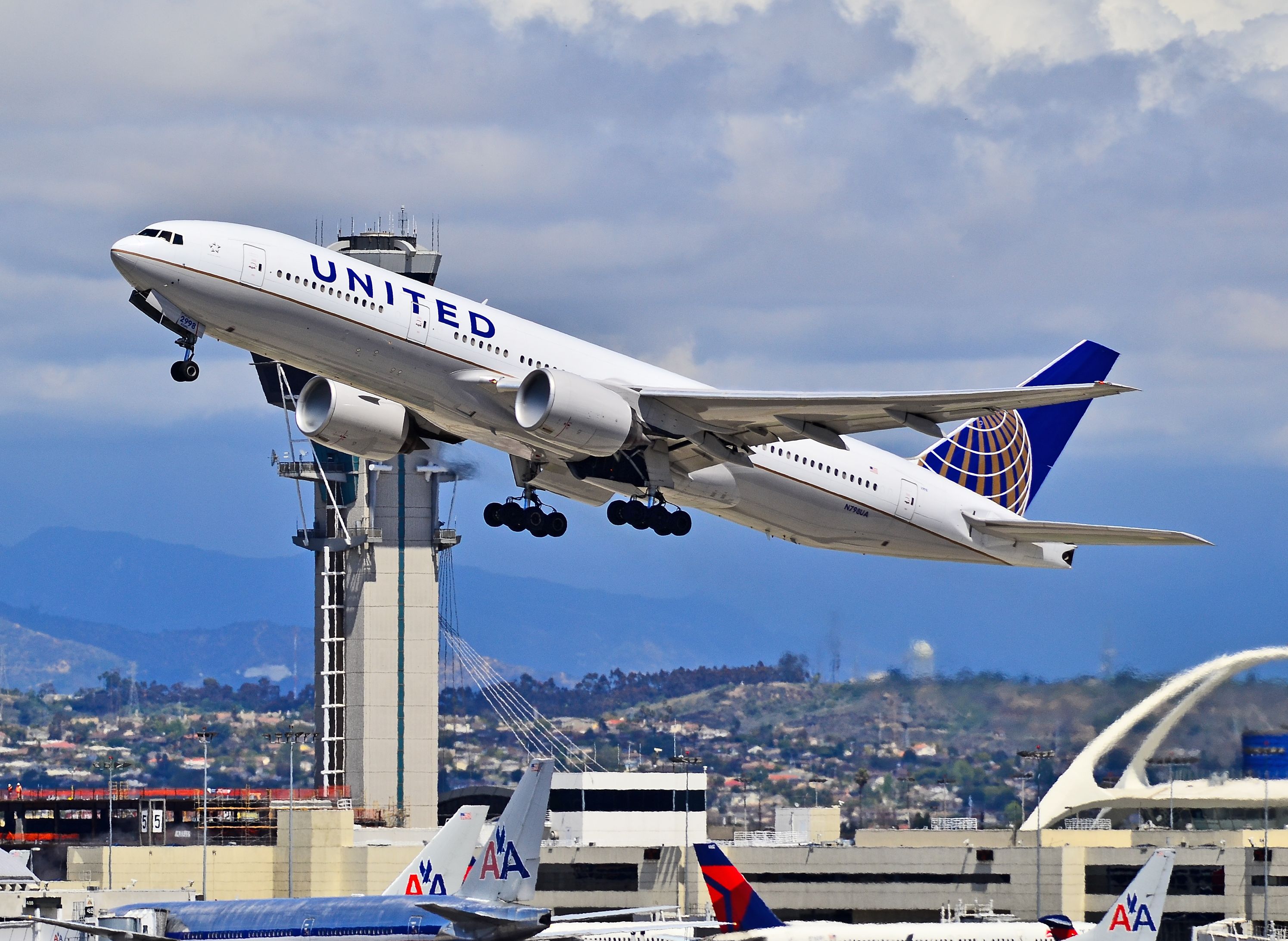 A United Airlines Boeing 777-200ER taking off from LAX.