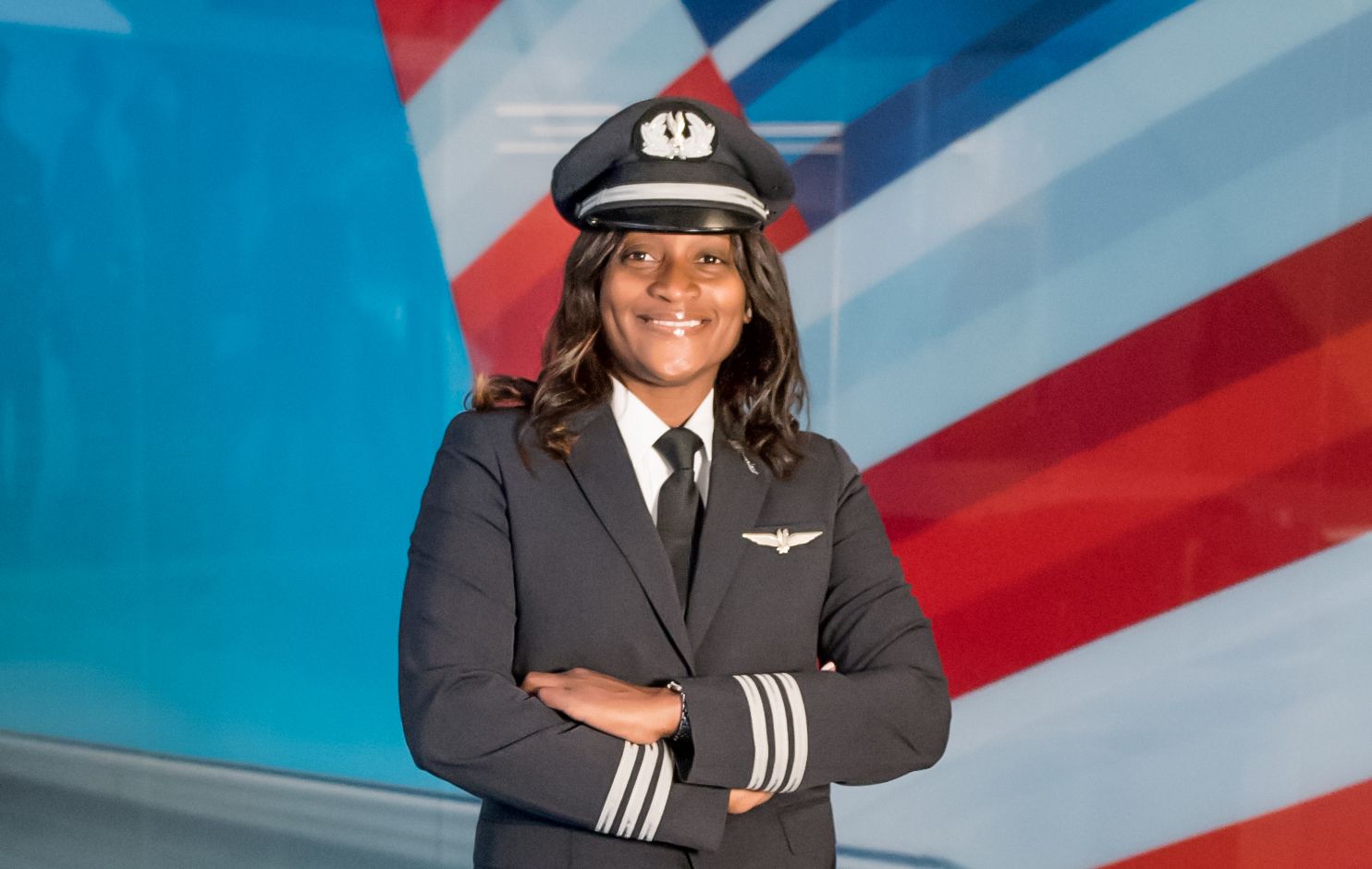 An American Airlines pilot wearing her uniform.