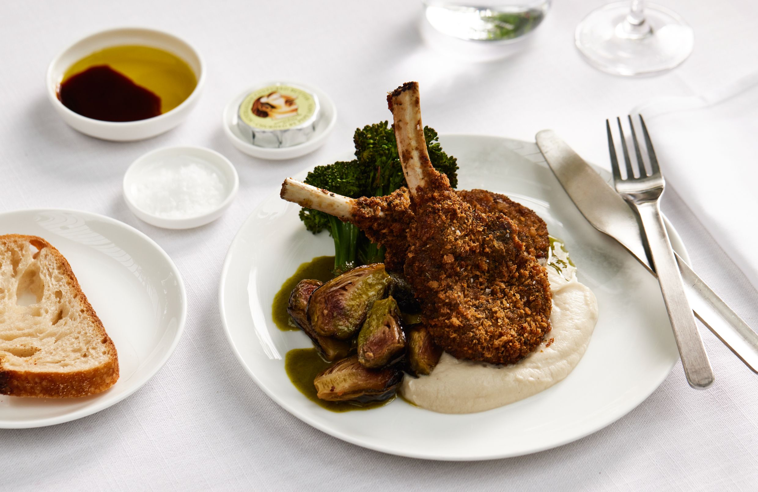 Qantas Crumbed Margra lamb cutlets with broccolini, brussels sprouts and lemon myrtle celeriac puree (First)