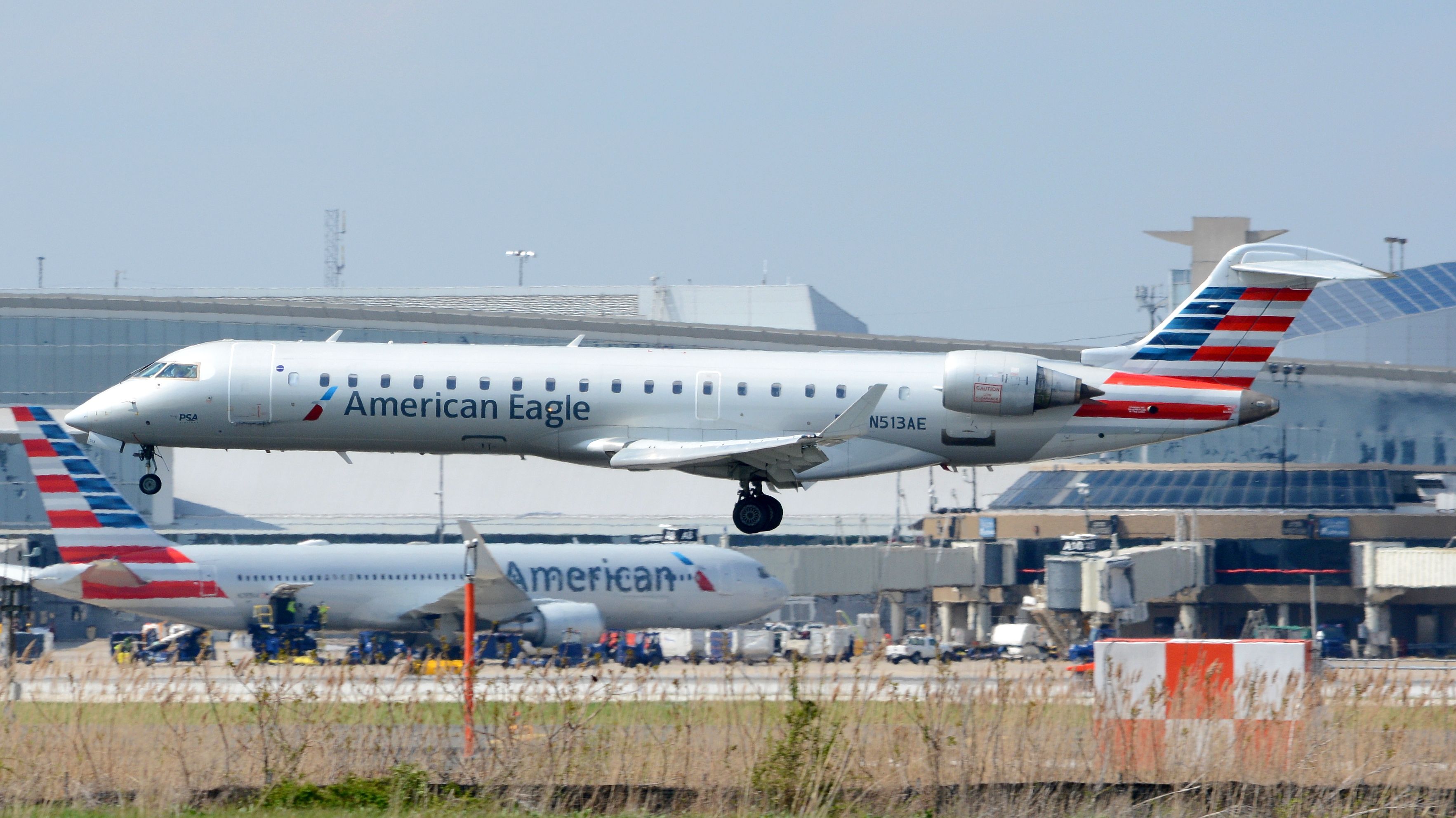 An American Eagle Bombardier CRJ about to land.