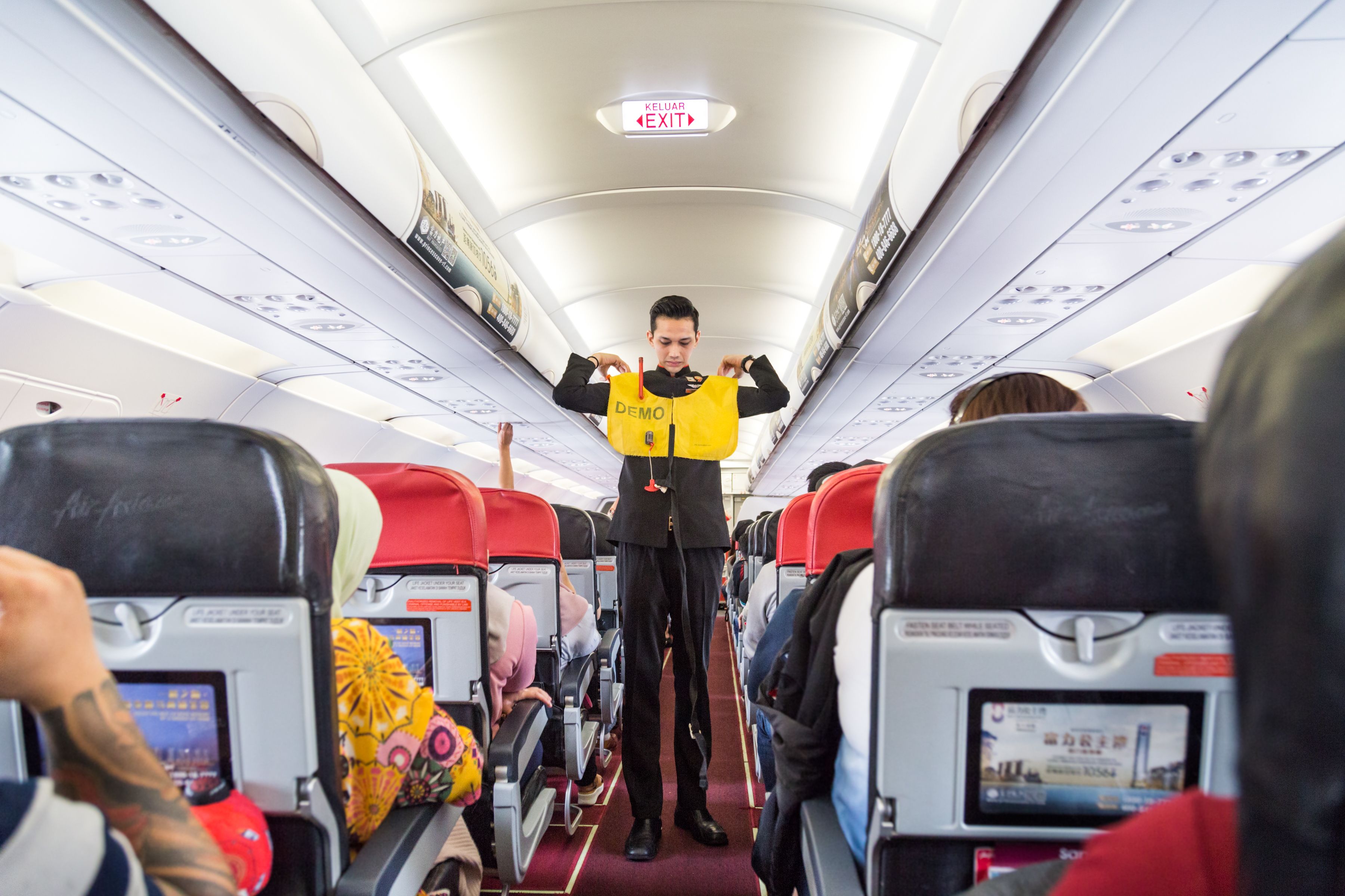 Safety demonstration by cabin crew.