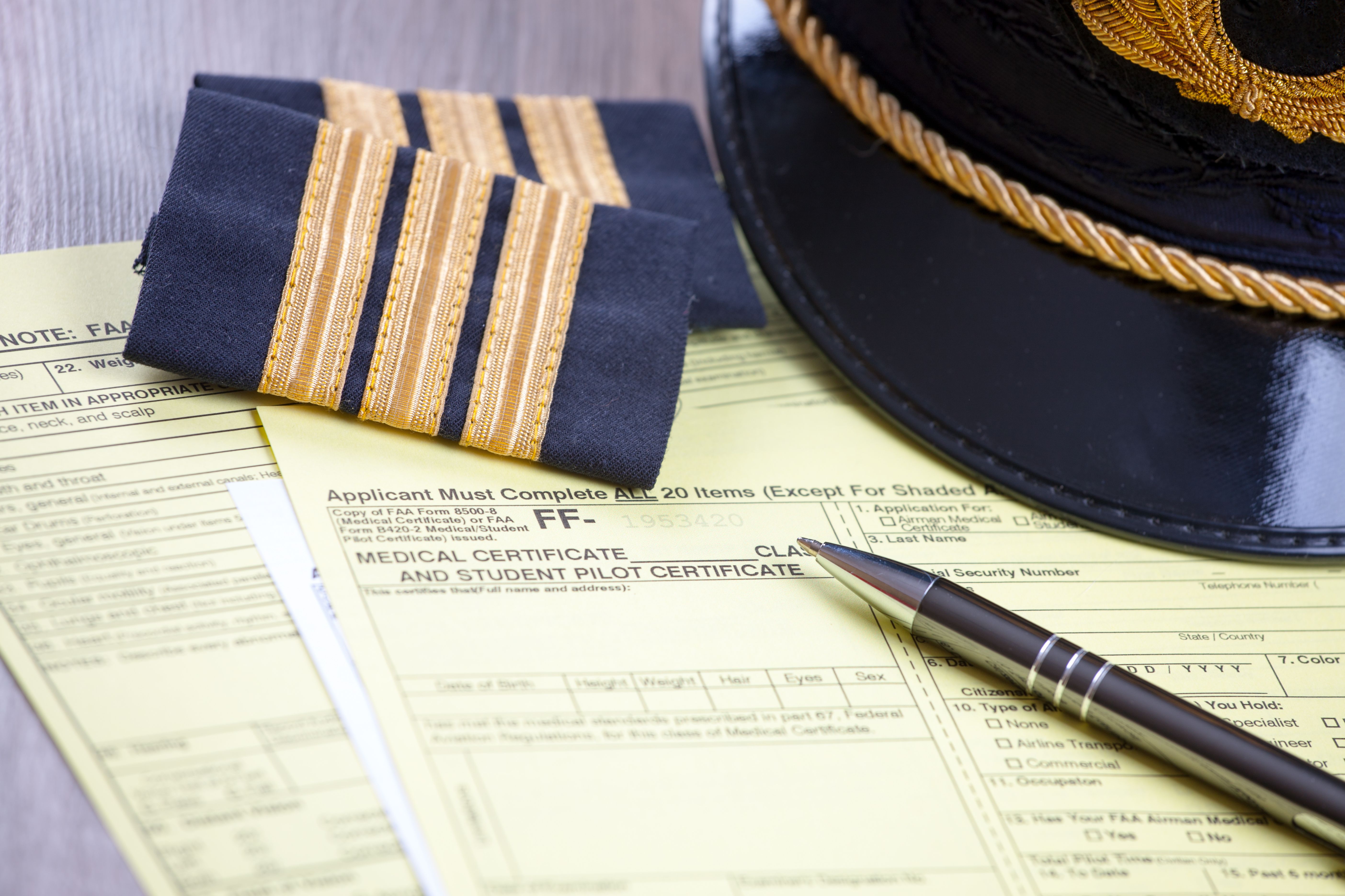 epaulettes and pilot's medical certificate.